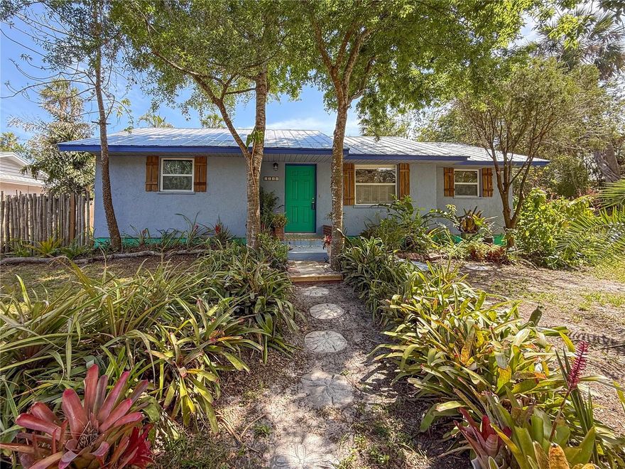 You are in for a real treat when you see this charming bungalow located in close proximity to vibrant downtown Sarasota and Ringling College of Art and Design. This delightful two bedroom home in Palm Grove/Bayou Oaks area has been lovingly cared for and updated for your enjoyment. You enter the home into the living room which opens to a bonus room currently set-up as a dining room. The darling kitchen with pantry has plenty of space for cooking and eating. Spacious breakfast area complete with farm style lighting, open shelving, solid wood cabinets with french door opening to the wraparound deck overlooking lovely gardens flowering with perinnals and annuals. Inside laundry room with full-size washer and dryer opens to side decks ready for your enjoyment. Fabulous yard with beautiful plantings and trees has capacity for your garden, toys and backyard fun. You are sure to enjoy the birds and ducks that come with living on a small, gently flowing stream. Seller’s staging furnishings can be negotiated.  This prime location affords convenient access to cultural venues, dining, retail, world-class powdery sand Gulf beaches. You are sure to find this sweet home an oasis for great memories to be made.