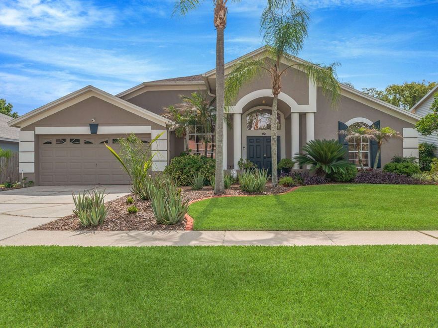 One or more photo(s) has been virtually staged. Welcome to this beautifully maintained pool home in the highly sought-after River Cross community of Bloomingdale East, where timeless elegance meets relaxed Florida living. From the moment you arrive, the lush tropical landscaping, inviting front porch, and exceptional curb appeal set the tone for what awaits inside.
Step through the front door into a light-filled open floor plan featuring soaring ceilings and neutral designer tones that create an airy and welcoming atmosphere. The spacious living and dining areas have sliding glass doors with plantation shutters that seamlessly connect indoor and outdoor living spaces, making entertaining effortless.
At the heart of the home, the open kitchen is designed for gathering and everyday living, offering custom wood cabinetry, stainless steel appliances, a breakfast bar, and a sunny breakfast nook overlooking the screened lanai and sparkling pool. The adjacent family room with dramatic vaulted ceilings provides the perfect setting for cozy evenings, celebrations, and making lasting memories.
This thoughtfully designed 3-way split floor plan offers both privacy and flexibility. The spacious primary suite is a true retreat with private pool access, a large walk-in closet, and an updated en-suite bathroom featuring dual sinks on a vanity with granite counters and custom cabinetry, a large walk-in shower with built-in seating, a custom storage cabinet and a private water closet. Two secondary bedrooms share a guest bath. The fourth bedroom at the rear of the home has access to a full bath that also serves as a pool bath creating the perfect private space for extended family, guests, or teenage children seeking added independence and privacy.
Outside, your private backyard oasis awaits. Relax beneath the covered and screened lanai, enjoy sunny afternoons by the shimmering pool, or entertain guests surrounded by mature tropical landscaping and a fenced backyard designed for privacy and tranquility. Recent pool upgrades include a new skimmer and equipment (2025), with pool resurfacing and elegant cobblestone-style pavers throughout the lanai area completed in 2010.
Additional features include Plantation Shutters throughout, tinted west-facing windows, decorative landscape curbing, and extensive kitchen & bathroom updates completed by the original owner for peace of mind, including: Upgraded A/C, Pool Skimmer, and fresh new sod (2025), exterior paint (2024) . Renovated kitchen and all 3 bathrooms,  New electrical box,  Pool resurfacing and lanai pavers (2010) Re-piped,and so much more.
Residents of Bloomingdale East enjoy low HOA fees and outstanding community amenities, including playgrounds, pavilion, basketball, racquetball, volleyball, pickleball, and tennis courts.  Conveniently situated near top-rated schools, shopping centers, dining options, and recreational facilities. With easy access to major highways, commuting to nearby cities or attractions is a breeze.
This exceptional home offers the perfect blend of comfort, style, and functionality in one of Bloomingdale’s most desirable neighborhoods. Schedule your private showing today and experience Florida living at its finest!