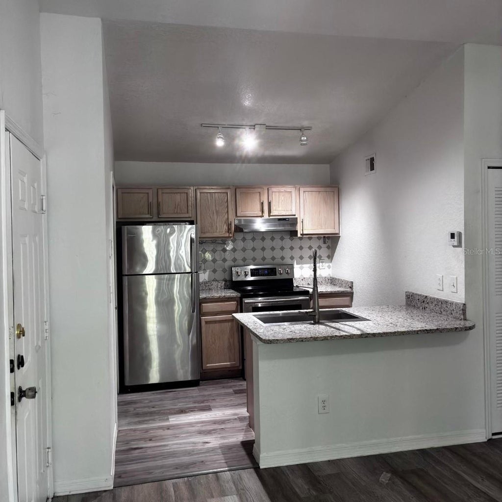 Photo of 8939 Latrec Avenue #1303, Orlando, FL 32819 (MLS # S5155022)