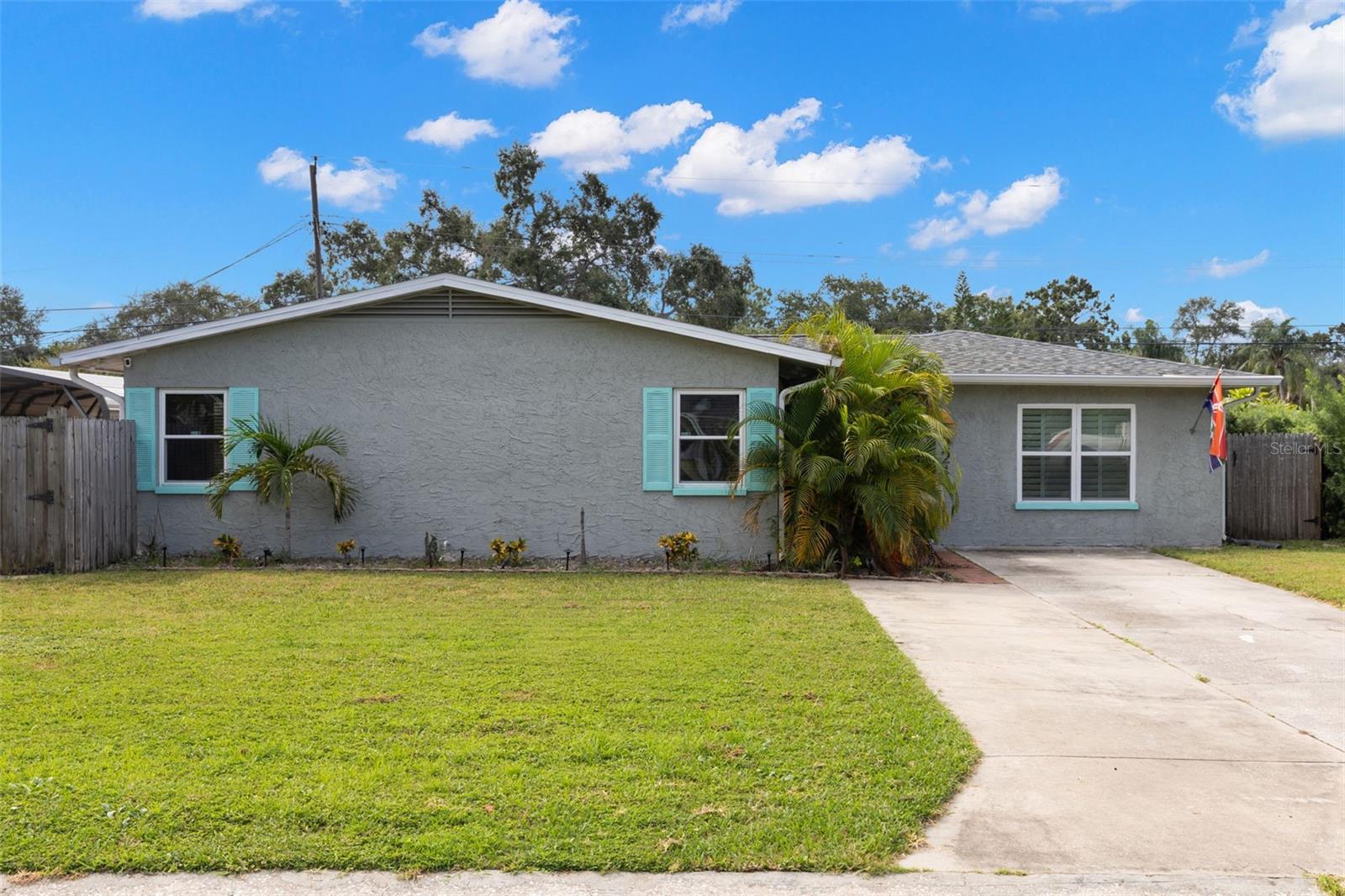 Welcome to your dream retreat in in St. Petersburg. A spacious 4 bedroom, 3 bathroom pool home with two primary suites, a new roof (Nov 2024), Newer HVAC (2023) and incredible upgrades designed for both everyday living and entertaining. Once you step inside, you’re greeted by a bright, open floor plan featuring a chef’s kitchen featuring quartz countertops, stainless steel appliances, an oversized island that seats 8+, a wine bar, and an abundant amount of storage. This home is perfect for hosting dinner parties, family gatherings, or casual Sunday brunch. The home’s dual primary suites are ideal for multi-generational living or private guest quarters. The expansive 670 sq. ft. addition (2015) offers a bath with wet-room shower and a large laundry/mudroom with extra storage, which is rarely found at this price point, also including energy efficient windows. Enjoy Florida living at its best in your backyard oasis: a 22’ x 22” pool with tiki-bar deck, creating a space that is perfect for pool parties and summer cookouts. There is a 16’ double gate opens to a massive paved parking pad with RV/boat carport, giving you secure space for all your toys. This home delivers the lifestyle today’s buyers want: space, flexibility, entertainment, and storage that is wrapped in a move-in-ready package that is only minutes to I-275, Gandy Bridge, downtown St. Pete, Tampa, shopping (Publix, Home Goods, Target), dining, parks, and boat ramps. Walk to nearby schools and enjoy the convenience of everything at your doorstep. This home sat high and dry during both storms and was not affected by any flooding. Don’t wait, homes like this in North St. Pete don’t last. Schedule your showing today before it’s gone!