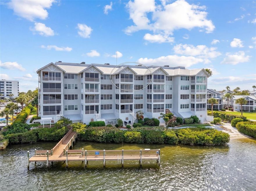 One or more photo(s) has been virtually staged. Experience endless panoramic views of downtown Sarasota and Sarasota Bay from the climate-controlled balcony of this newly renovated top-floor residence in the gated community of Dolphin Bay on Siesta Key. This spacious condo offers just under 2,000 square feet of beautifully updated living space, featuring 2 bedrooms, 2 bathrooms, and a den, all enhanced by vaulted ceilings that create an open and airy coastal atmosphere. From the front entryway, enjoy stunning nightly sunsets over Siesta Key Beach, adding to the exceptional appeal of this home.

Residents of Dolphin Bay enjoy a true waterfront lifestyle with access to a private community dock, clubhouse, tennis and pickleball courts, fitness center, and a resort-style pool. A private one-car garage is conveniently located just steps from the elevator, offering ease and security. Perfectly situated within minutes to the beach, shops, and restaurants, this residence combines luxury, convenience, and the best of Siesta Key living. Enjoy the waterfront lifestyle at its finest in this exceptional move-in-ready home.