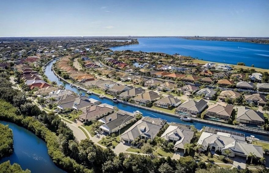 This spectacular Neal Signature home is a boater’s dream! Built in 2017 to the highest standards, this home sits on one of the largest canal-front lots, offering 75 feet of water frontage in the gated enclave of Harbour Walk at The Inlets. A private 20,000 lb boat lift provides easy access to the Manatee River and the Gulf of Mexico. Unwind after a day on the water in the saltwater pool and spa, or entertain at the water’s edge from the expansive covered lanai featuring a stone fireplace and outdoor kitchen.
Open living spaces are bathed in natural light from numerous windows and sliding glass doors, seamlessly blending indoor and outdoor living. Enjoy cooking and entertaining in the chef’s kitchen, which features a double oven, commercial-grade gas stove, quartz countertops, Carrara marble backsplash, oversized island with elegant pendant lighting, and opens to the main living area.
Wake up to glistening water views from the private owner’s retreat, complete with dual walk-in closets and a spa-like en-suite offering dual sinks, a walk-in shower, and a soaking tub. Two additional bedrooms, a den/office with dual French doors, and a bonus pool room—ideal for a gym or additional bedroom—complete this exquisite home.
With over $150,000 in upgrades, including a three-car garage with paver driveway, new front doors, extra insulation for energy efficiency, plantation shutters, central vacuum, crown molding, new tile flooring in the bedrooms, and a newer boat lift, all that’s left to do is move in.
Not only is this prime location ideal for boating and dolphin sightings, but the neighborhood is also just minutes from I-75 and an abundance of shopping and dining.
What I Love About This Home
• Newer 20,000 lb boat lift
• 75 feet of freshwater canal frontage
• Boats up to 40 feet allowed (maximum 25,000 lbs)
• End-of-canal location—perfect for flushing engines after a day of boating
• Beautiful sunset views
• No homes across the street—protected wetlands views
• One of the nicest pools and lanais in the neighborhood
• New tile floors in all bedrooms and the pool room.