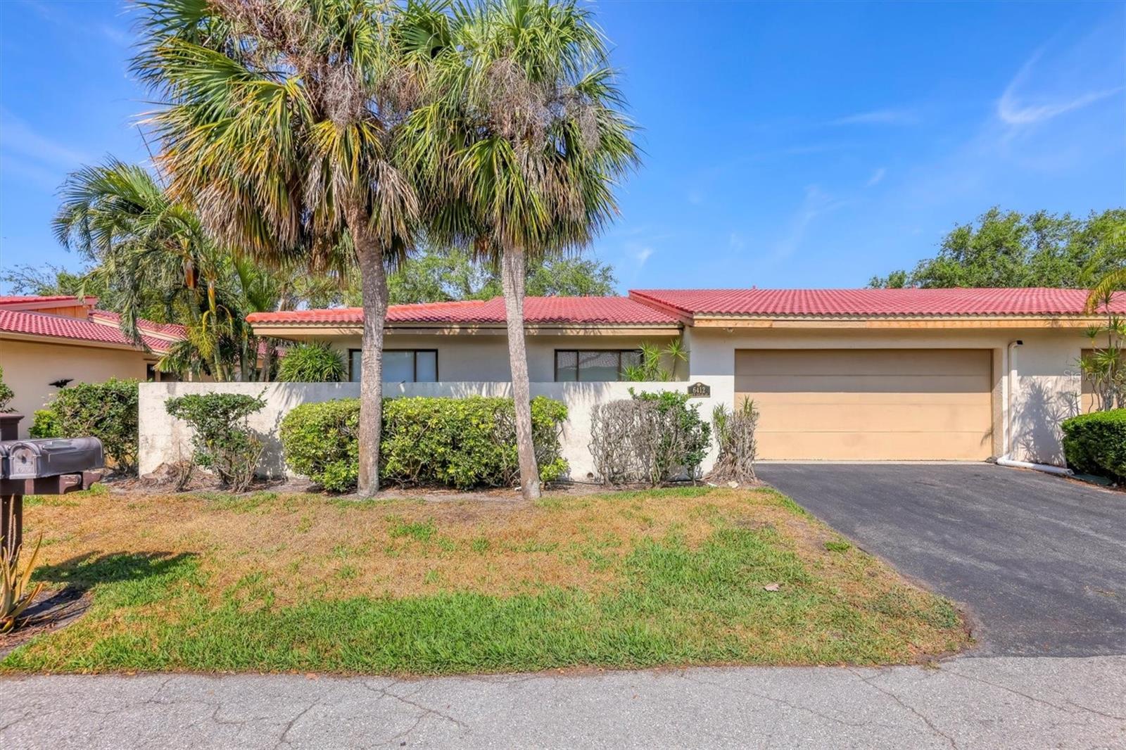 Welcome to your private oasis in the highly desirable community of Wild Oak Bay. This spacious three-bedroom, two-bath villa offers 1,805 square feet of living space, cathedral ceilings in the great room and a two-car garage with epoxy floors. The wrap-around private courtyard is ideal for morning coffee, gardening or simply enjoying the Florida lifestyle in peace. Set in a quiet, peaceful neighborhood along Sarasota Bay, Wild Oak Bay is known for its lush landscaping and is ideal for taking relaxing walks. While the community borders the bay, this particular villa is located in an X500 flood zone for added peace of mind. Inside, you'll find a bright, open layout with no carpet, tile floors run throughout. The home is loaded with valuable updates including a new tile roof, new gutters (scheduled for install), and fresh exterior paint also scheduled and coming soon. The air conditioning and ductwork were replaced in 2021, the water heater in 2023, the electrical panel in 2020, and the new washer and dryer were installed in 2024. This pet-friendly section of Wild Oak Bay allows two pets, and the HOA covers water, trash, internet/cable, lawn care and perimeter irrigation. The courtyard also has its irrigation system maintained by the homeowner. Community amenities include a pool and proximity to IMG Golf Course and IMG Academy. Just minutes to the Sarasota-Bradenton Airport, beautiful Gulf beaches, shopping, dining and medical services. You won’t find many villas with a wraparound courtyard that gives privacy and enjoyment like this one does, so come see for yourself and fall in love with Wild Oak Bay.