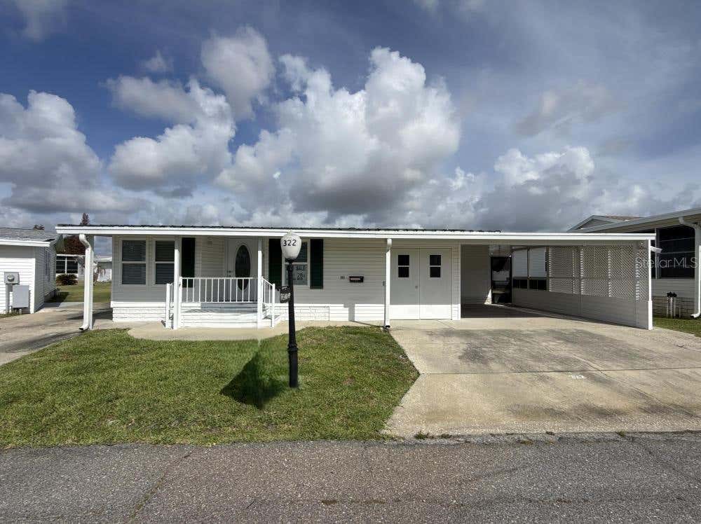 Photo of 322 Melbourn Drive, Haines City, FL 33844 (MLS # J1002192)