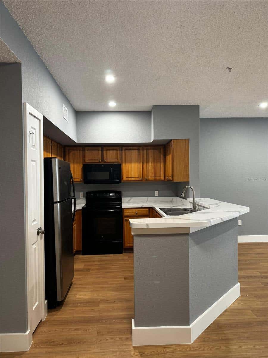 Photo of 13001 Mulberry Park Drive #112, Orlando, FL 32821 (MLS # O6433835)