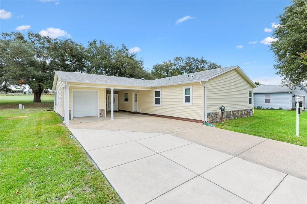 Photo of 723 Heathrow Avenue, Lady Lake, FL 32159 (MLS # G5113691)