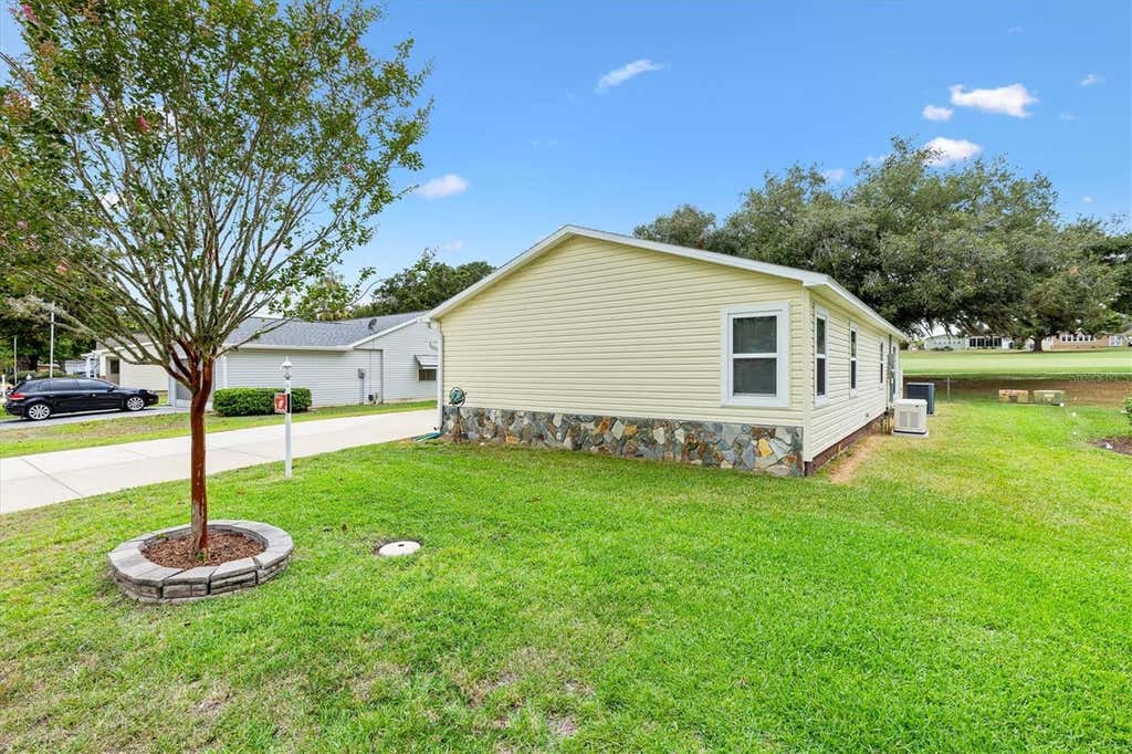 Photo of 723 Heathrow Avenue, Lady Lake, FL 32159 (MLS # G5113691)