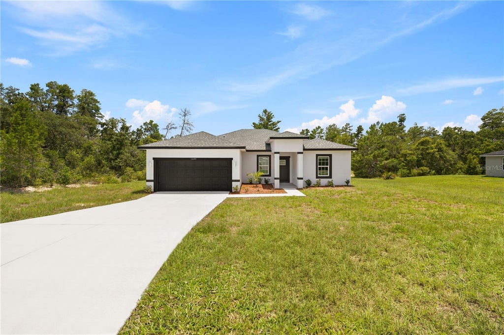Photo of 1939 SW Viburnum Road, Dunnellon, FL 34431 (MLS # O6441022)