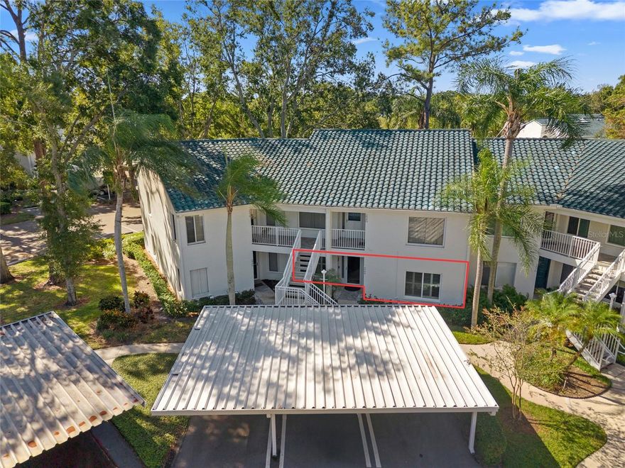 Hard-to-find 1st Floor Unit in the prized Indigo Pond Community - this rare gem is gorgeous and move-in ready, offering the perfect combination of convenience, style and comfort. Nestled back in a quiet neighborhood near John Chestnut Park and Lansbrook golf course, this welcoming home provides a serene retreat while keeping you close to everything in town that you love! Enjoy the ease of first-floor living with hard-to-find backyard privacy, perfect for a small dog - yes, pets are welcome! Step inside to find a meticulously maintained, updated home with modern finishes, stone countertops and a spacious enclosed lanai perfect for relaxing or entertaining family and friends. The main living spaces feature warm wood-look porcelain tile plank flooring with lush carpet in the primary bedroom. Plantation shutters bring timeless style while the newer hurricane windows provide privacy, safety and quiet. The kitchen offers plenty of cabinet and countertop space, matching stainless steel appliances, a roomy breakfast nook and a water purifier at the kitchen sink. You’ll find ample closet space, giving you all the storage you need in a well-designed layout. The best part? The split floor plan and impressive primary bedroom with a walk-in closet and en-suite bathroom. The second bedroom also has an updated guest bathroom nearby, along with a hallway laundry closet including a full size washer and dryer which convey. Have large furniture? The dining and living room can fit it all! The generous spaces can fit large furnishings, and you can extend your living room even more by opening the sliders to the enclosed lanai. Just a swift walk from your back door, cool off at the community pool which is also heated for those cooler winter nights, BBQ at the poolside kitchen or stroll the lush grounds that make this all-ages community so inviting. Important updates include a 2019 AC system, hurricane impact windows installed in 2023 and a tile roof with many years of life left! Outside you have an assigned carport, storage shed and plenty of guest parking. With an unbeatable location near John Chestnut Park, the popular Lansbrook golf course and YMCA, this condo has something for everyone. Non-Flood Zone X and zoned for top-rated Pinellas County schools (including East Lake High) and surrounded by popular restaurants, shopping, golf, movie theater, Mease Countryside hospital, and pristine Gulf Coast beaches — rarely available and ready for you to call home - Call me today to schedule your showing while you can!