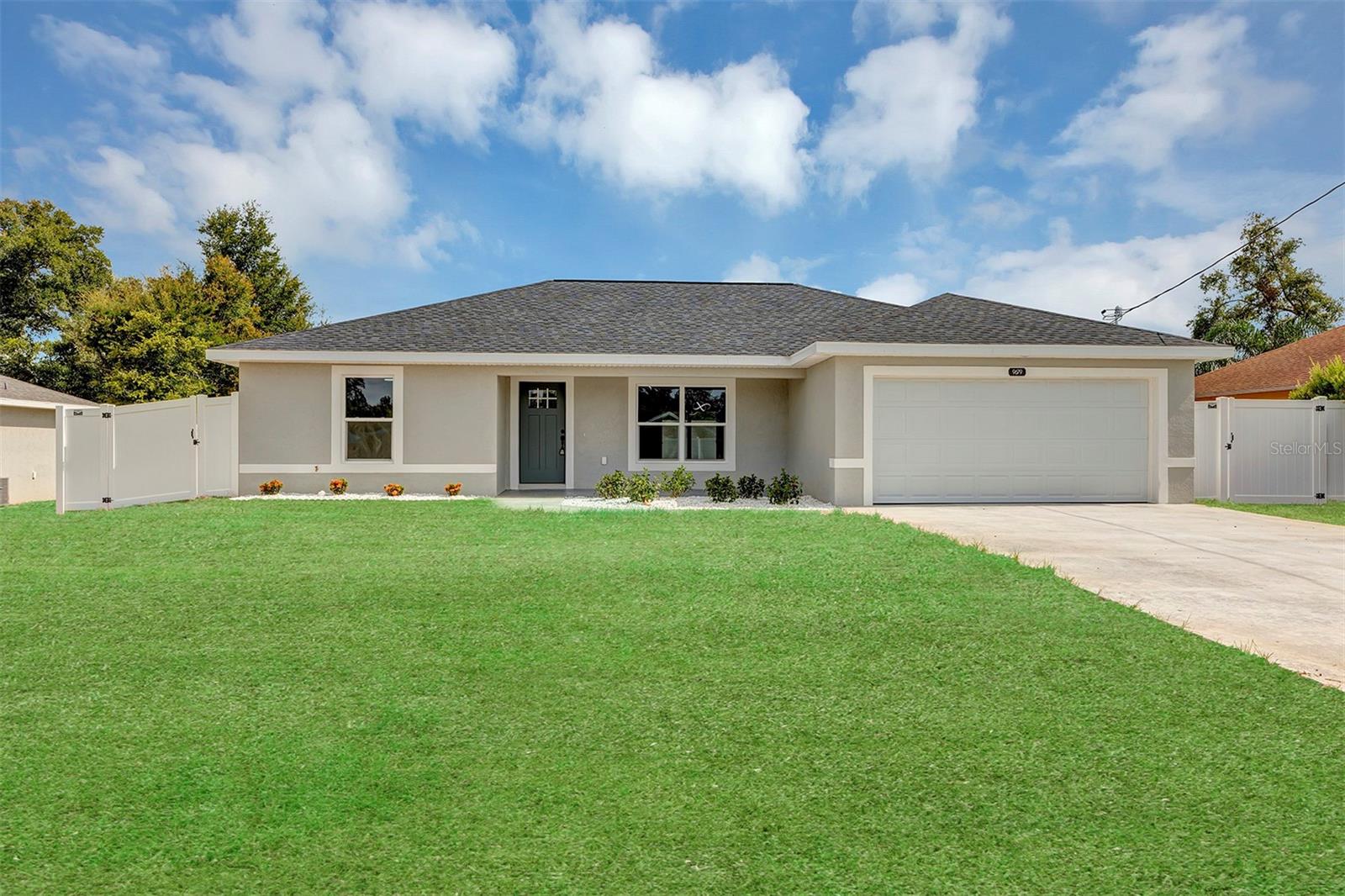 Move in Ready!! New construction, This Beautiful 3 bedroom, 2 bath, 2 car garage home was built to the highest of standards to include stainless steel appliances, luxury vinyl plank flooring, custom kitchen with high top soft-close cabinets and quartz counter tops, ceiling fans and inside laundry. This home has Modern light fixtures, quartz counters in all bathrooms, double sink in master with beautiful tile not to mention additional soft close drawers in master bath. The front entry is stunning with a modern front door with inlaid glass and beautiful landscaping. Enjoy the beautiful Florida weather on the screened back porch overlooking the fully fenced backyard!! The garage is epoxy coated, these are just another of the builder’s personal touches to make your home complete and ready for your family to move in.
NO HOA, Located within minutes of The Villages, shopping, dining and entertainment. Full one year builder warranty with an extended 2-10 warranty provided at closing. Come see this one, we know you will be impressed and get your offer in as it will sell quickly!!