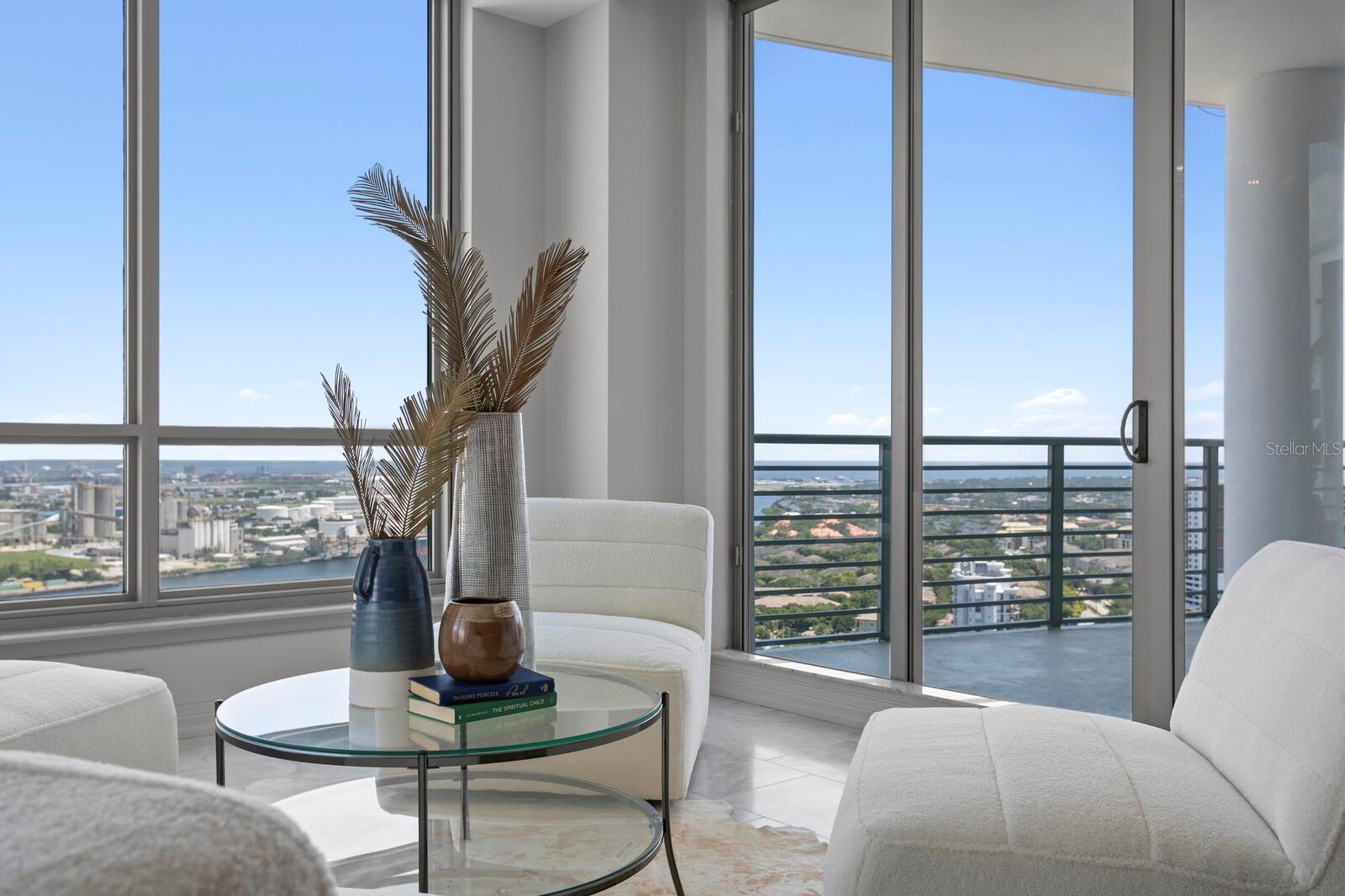 Welcome to the exclusive Towers of Channelside PENTHOUSE, offering an unparalleled living experience in the heart of Tampa. This massive 3-bedroom, 3-bathroom condominium renders a luxurious living experience with stunning features and BREATHTAKING PANORAMIC VIEWS. With 10-foot ceilings and 9-foot sliders/windows, the living spaces are filled with natural light and a sense of grandeur. This unit boasts not one, but two HUGE COVERED BALCONIES overlooking Sparkman Wharf and Port of Tampa, perfect for watching the cruise ships depart or enjoying the stunning views of the waters surrounding Hillsborough Bay. Be captivated by the elegant design and high-end finishes throughout including CARRARA MARBLE FLOORS, crown molding, power blinds, 2-zone AC with Nest thermostat, and modern Legrand Adorne switches/outlets which add a touch of elegance to every room. The chef's dream kitchen is equipped with a double wall oven, a 42" GE Profile Refrigerator, Omega European cabinets w/ soft-close drawers/doors, and an exquisite zero-edge sink. ABSOLUTE BLACK GRANITE COUNTERTOPS elevate the space, while off the kitchen, a dry bar w/ built-in wine & separate beverage fridge await for seamless entertaining. Ready for a spa-like experience? The recently upgraded master bathroom showcases Quartz countertops, DOLOMITE MARBLE FLOORS, Omega Cabinetry, extra outlets, cable access, a floating tub, lit vanity mirrors, wall mount taps and a floor-to-ceiling glass walk-in shower equipped w/ a rain shower head, body jets, & a hand sprayer bringing your bathing experience to the next level. Secondary bathrooms feature marble flooring and quartz countertops w/ frameless glass enclosures. To top it off, this unit also comes with a new hot water recirculating pump - ensuring a never ending supply of hot water while saving on energy and water usage! The home is prewired for surround sound and includes a hot water self-cleaning tank. The spacious floor plan features a FOURTH ROOM with a Murphy bed, providing flexible living options for guests or a home office. Designed with comfort in mind, this unit also includes FOUR DESIGNATED PARKING SPOTS - a true luxury in urban living. Indulge in the abundance of amenities available to residents, including full time concierge service, clubhouse, & the crown jewel of it all - the RESORT-STYLE POOL, which is undoubtedly the best in all of Tampa. New elevators are being installed in both towers (PAID). PETS ARE WELCOME! The Towers offers two off-leash areas, ensuring that your furry friends can also enjoy the wonderful amenities this building has to offer. When it comes to location, you couldn't ask for more. The Towers is situated in the heart of Tampa, surrounded by vibrant entertainment, dining, & shopping options. Situated just one block from Amalie Arena, and a mere half-block from Publix, you'll have convenient access to all the amenities you desire. The free trolley to historic Ybor City awaits right outside the front entrance, along with proximity to the Riverwalk, Channelside District, the new Water Street, numerous parks, and other downtown entertainment. With easy access to major highways, you'll also find yourself just a short drive away from the beautiful Florida beaches and all that the Sunshine State has to offer. If you're looking for the ultimate living experience where luxury meets convenience, don't miss out on this extraordinary penthouse. Elevate your lifestyle and indulge in the finer things in life!