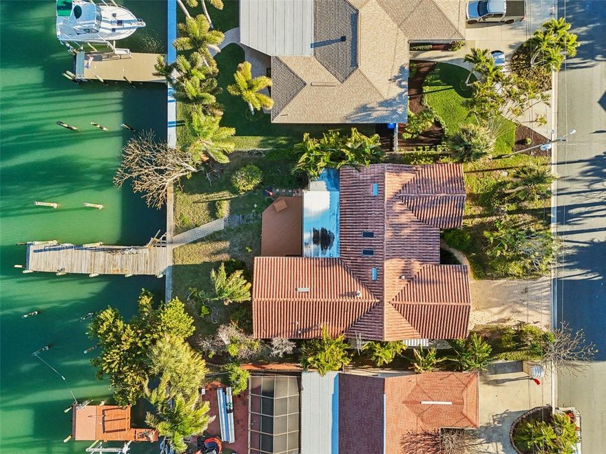 Treasure Island Isle Capri residence! This home was flooded during Hurricane Helene and is positioned for a full renovation or tear down/new build opportunity. The home features a nice tile roof installed in 2014 and is solid block construction. The seawall is in good shape and there is a dock that is usable but could use some repairs and improvements. This home presents a unique opportunity for an investor or homeowner looking to renovate and live. The lost size is 70 feet wide by 120 feet deep. Isle Capri is a wonderful neighborhood offering quick access to the beaches as well as St Petersburg and everything Tampa Bay has to offer.