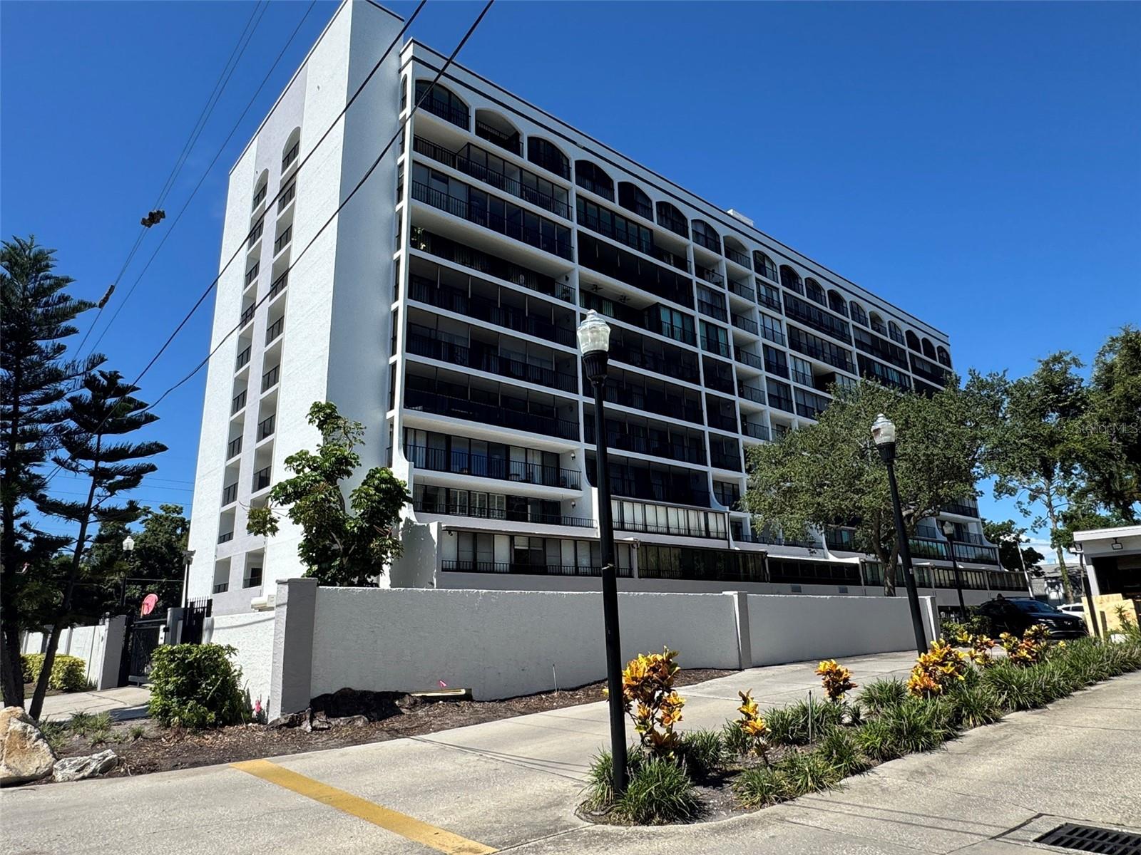 Opportunity awaits in this 9th-floor condo with sweeping views of South Tampa’s majestic oaks and Bayshore skyline. This spacious 2-bedroom, 2-bath unit offers 1,248 sq ft of potential, featuring a desirable open living and dining layout with a split-bedroom floorplan for added privacy. The unit is ready for your personal touches—update it to match your style and make it your own. Enjoy the convenience of an in-unit washer and dryer, a walk-in closet in the primary suite, and one assigned covered parking space. The community amenities include a pool, outdoor grilling area, a fully equipped fitness center, event space, and 24-hour security guard. All of this in the heart of South Tampa just moments from Old Hyde Park Village, SoHo, and Bayshore Boulevard. Top Rated Mitchell Elementary, Wilson Middle and Plant High School