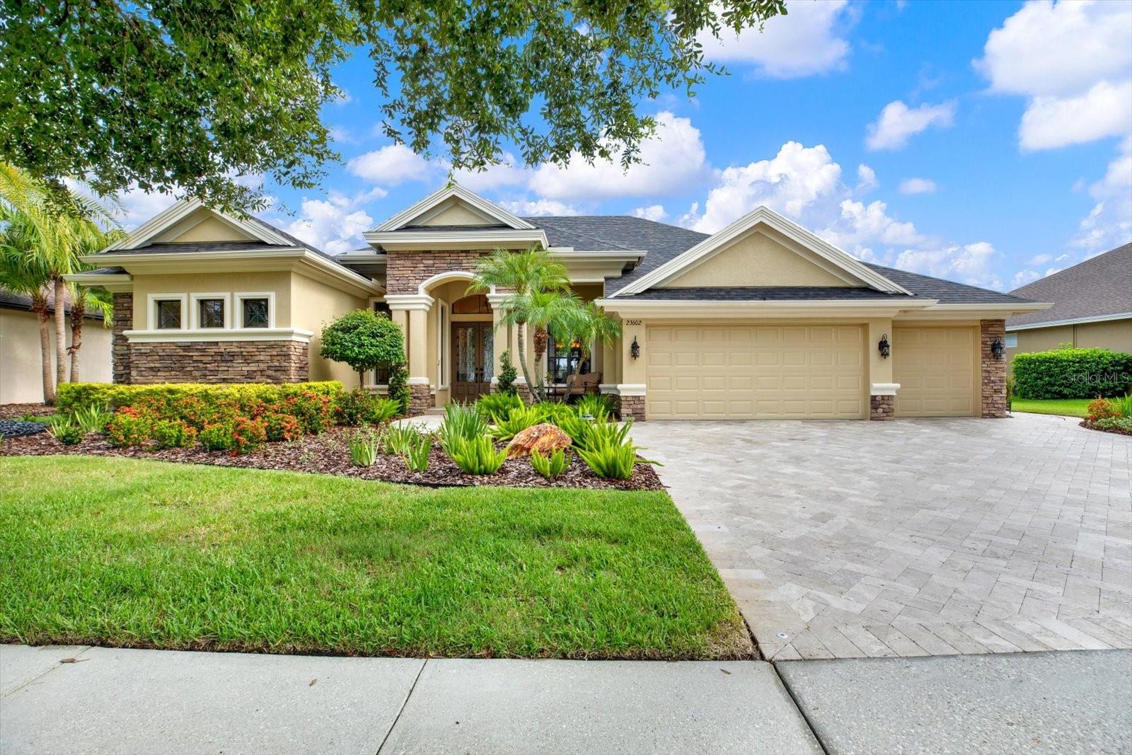 Under contract-accepting backup offers. Located within the highly sought-after gated community Plantation Palms, nestled along the 8th Green of the Savanna subdivision, this stunning 4-bedroom, 3.5-bathroom 2009-built home offers 3,538 square feet of meticulously crafted living space. Highlights include Travertine tile flooring, granite countertops, and GE Profile appliances in the kitchen. The living room features a wood-burning fireplace and French doors leading to the conservatory, which provides views of the 8th Green. The primary suite offers sliding doors to a private lanai, dual-access closets, and a vertical spa shower and jacuzzi soaker tub. Recent updates include NEW Interior painted (April 2022 & June 2025), NEW Exterior painted (June 2025), a NEW Roof (October 2024), and NEW Interior Carpeting (July 2025), NEW Pentair SuperFlo Spa Pump (July 2025) & NEW IntelliChlor Plus 30 Salt Chlorine Generator (July 2025). Enjoy a spacious outdoor oasis featuring a SALTWATER POOL, natural gas-heated SPA, and an OUTDOOR KITCHEN with a full-size Blaze grill and so much more. Community amenities include an 18-hole golf course, miniature golf, Mulligan’s Pub, and proximity to A-rated schools, retail, and dining options. You do not want to miss this spectacular Land O Lakes home!