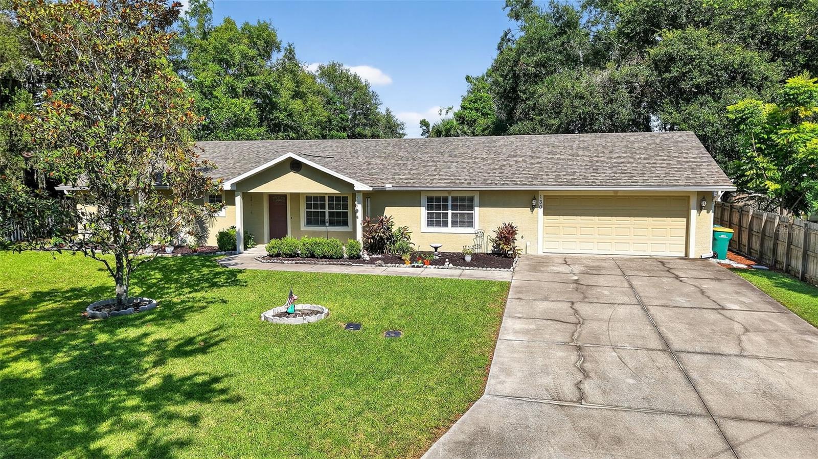 Beautiful 4BR/3BA home in the heart of Mount Dora with 2,439 sq ft of living space on a .34-acre lot. This 2006-built residence has a brand-new roof and offers an inviting covered front porch. Step inside to find a bright, open floor plan with tile floors, and spacious living and dining room areas. The well-equipped kitchen overlooks the living room and has a breakfast bar, gas range, stainless steel appliances, large closet pantry and laundry area. The guest bedrooms are nicely sized, and the guest bathroom has shower with tub. The primary suite has walk in closet and the ensuite bath vanity with makeup/vanity space and walk in shower. The attached in-law suite with its own full kitchen, living area, bedroom, and bathroom provides flexibility for multigenerational living, guests, or rental income. Two car garage offers an additional laundry space and an air conditioned flex room that would be great for a home office, work out room, art studio etc. The large, fenced backyard is ideal for entertaining or future enhancements, such as a swimming pool or accessory building. Other highlights include tankless (natural) gas hot water heater, 2 HVAC systems 2020 and 2018, Just a short walk to downtown Historic Mount Dora’s boutique shops, fine dining, festivals, parks and Lake Dora!