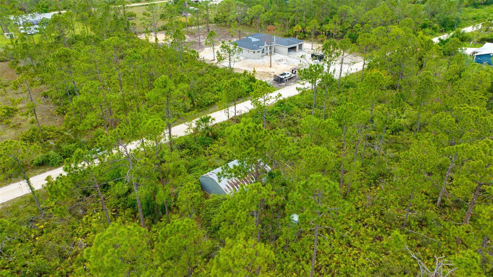 ***Lookin for an Amazing Property to Build your dream home*** We have the right lot for you 2.5 Acres. Close proximity to all the area is known for such as shopping, golfing, entertainment, restaurants, airport nearby and a pristine beach just minutes away. Great area for nature lovers, storing your toys such as RV, boat or motorcycles or just growing your own vegetable garden and best of all no HOA. There is a metal barn (Quons brand) that was installed in 2007 it is 750 sq. ft. included plus the camper that is parked inside. Zoned for agriculture build your own chicken coop and stables and own chickens and horses. This property is the perfect place to grow and enjoy the Florida outdoor experiences a laid- back lifestyle. Many new homes are being built close by take a ride and experience contry living.