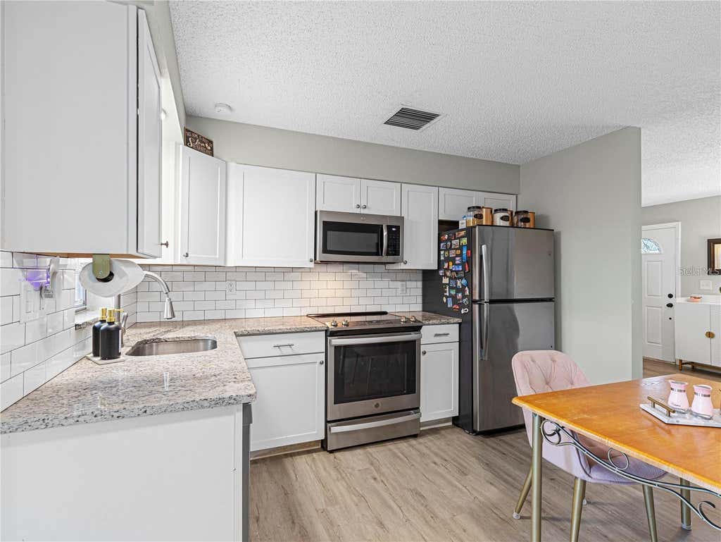 Photo of 3124 Lecanto Street, Holiday, FL 34691 (MLS # O6430360)