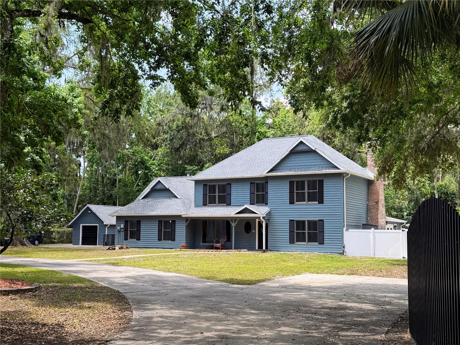 An exclusive private estate in a highly desirable neighborhood in New Smyrna Beach. This five-bedroom home is the perfect place for a large family. The back patio is ideal for entertaining with a new saltwater pool, BBQ, and fire pit, multiple covered sitting areas, and is surrounded by a new white vinyl fence. Your family will rest easy knowing there is a block perimeter wall, gated access, and a home security system. It is a one-of-a-kind home that you do not want to miss. The detached garage and one-acre lot have plenty of room to store all the toys. The attic adds a third story, fully air-conditioned, with two bonus rooms! Some of the recent upgrades include a new roof, new A/C units on the first and second floors, new flooring in most areas of the house, new septic tanks and a drain field, a remodeled second bathroom, and a new shower in the master bath. Close to the beaches, shopping, restaurants, and easy, quick access to I-95 and I-4. Motivated Seller!!