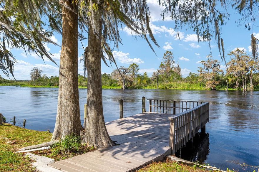 If you're looking for an exquisite, quality, waterfront home you have the opportunity to buy this dream property now! Picture yourself relaxing on the micro screened lanai in all seasons with your favorite beverage enjoying the never ending view of the river. The heart of the home focuses around the open plan kitchen/living area with vaulted ceilings, simple clean lines, and no stairs to worry about making it a great choice for those ready to retire and age in place. It’s also a great option for a family who loves a large yard and values time spent outdoors boating, fishing or kayaking. With a fenced yard and  large asphalt parking pad your RV, boat, toys and animals can all fit here. This is the place to create your utopia. This 3Bedroom- 2 ½ bath house has had no detail overlooked, pride of ownership can be seen throughout the home, including all updates between 2022-2024 to ensure a luxury feel while being able to be safe in any kind of weather. In the home you’ll find a chef’s dream kitchen with solid wood cabinets and a walk in pantry. The spacious primary bedroom features a walk-in closet and his/her custom wood vanities in the primary bath. This quality, and prime, riverfront property leaves no detail untouched from the porcelain tiled front porch, luxury vinyl plank flooring, porcelain tile in bathrooms, board and batten Hardie board siding, boat dock, seawall, deep water access, and so much more. Artfully placed on just under two peaceful acres filled with mature trees, a panoramic view of the river, this modern ranch inspired home has plenty of space to spread out PLUS there is an additional 600 sq ft detached building on river with water, electric and a septic tank permit suitable for the hobbyist, crafter, wood worker, or future mother in law suite- the sky and your imagination are the limit with this building. Located in the Beery Subdivision 2.8 miles from Dunnellon where the town atmosphere has all the essentials one could desire. You can have the freedom of country living while being close enough to get to parks, swimming. restaurants, kayaking, and so much more. **Watch the virtual walk-through**
ROOF WITH LOW E RADIANT BARRIER 2022, STAINLESS STEEL APPLIANCES & SUBZERO BEVERAGE CENTER 2024, UTILITY/LAUNDRY ROOM (with custom wood cabinets) ADDITION 2022, some PLUMBING & ELECTRICAL 2022, ELECTRICAL PANEL 2024, 3-TON HEAT PUMP 2022, HOT WATER HEATER 2022, VINYL/DOUBLE PANE/LOW E WINDOWS (w/ a transferable lifetime limited warranty).