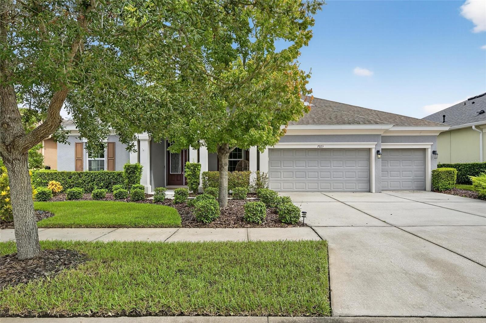 7223 Bowspirit Place | 4 Bedrooms | 3 Bathrooms | 3-Car Garage | 3,129 Sq Ft | Pool Home | Bonus Room | Oversized Lot with Pond Views
This award-winning 2014 WestBay Longboat floorplan is designed for Florida living at its finest. Set on a peaceful pond with long water views, the home features an oversized saltwater pool with upgraded pavers, a newer lanai fence, and a deep lot with a fully fenced backyard. The outdoor space has been thoughtfully updated with fresh landscaping and is perfect for entertaining or relaxing while enjoying the evening glow of the pond’s lighted fountain.
Step inside through double doors into a bright foyer with soaring 12-foot ceilings that flow seamlessly into the open-concept grand room. The gourmet kitchen is a chef’s dream with granite and Zodiaq quartz counters, 42-inch cabinetry with under-cabinet lighting, a custom backsplash, stainless steel appliances, a gas cooktop, and a massive island overlooking the pool and pond. The connected dining and living areas create an inviting atmosphere for everyday living or hosting.
The large media/bonus room at the rear of the home is currently configured as a theater with the projector, blackout curtains, and screen conveying.
The primary suite is a retreat of its own with tray ceilings, crown molding, and a sitting area overlooking the water. The spa-inspired bath includes a jetted garden tub, oversized shower, and an enormous walk-in closet with direct access to the laundry room. The split floorplan offers privacy, with three additional bedrooms finished in beautiful wood-look tile flooring.
Outdoors, the screened pool area is complete with bug-proof screening, outdoor speakers, upgraded pavers, and space for grilling under the lanai. The fenced backyard is ideal for pets, and the cul-de-sac location with a front green space offers a safe play area. Additional features include a reverse osmosis system, a whole-home water filtration and softener system, and a spacious 3-car garage.
Living in Waterset means access to one of Apollo Beach’s premier master-planned communities. Residents enjoy resort-style amenities including multiple pools, a splash pad, dog parks, playgrounds, fitness centers, and over 12 miles of walking and biking trails. The 20-acre outdoor sports complex is a centerpiece of the neighborhood, featuring tennis, basketball, pickleball, and sand volleyball courts. A large clubhouse, café, and year-round community events make it easy to connect with neighbors and embrace an active Florida lifestyle.
This one-story home combines luxury, thoughtful upgrades, and the best of Waterset living—schedule your private showing today.