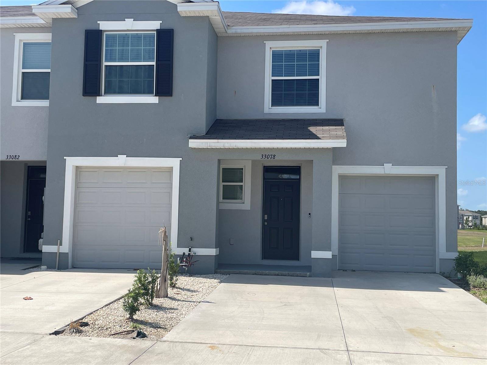 Live in the heart of Wesley Chapel in the vibrant community of Avalon Park, where you'll enjoy access to multiple pools, playgrounds, picnic areas, and an on-site elementary school. This spacious 3-bedroom, 2.5-bathroom end-unit townhome offers added privacy with only one adjoining neighbor. Step outside to a large, extended lanai overlooking a peaceful pond—perfect for relaxing or entertaining. Inside, the open-concept layout features a stylish kitchen and living room combo with sleek tile flooring and modern finishes throughout. Upstairs, you'll find all three bedrooms, a convenient laundry room, and a flexible loft space—ideal for a home office or playroom. Two of the secondary bedrooms share a pass through bathroom for added functionality. Located just 15 minutes from daily essentials, shopping, dining, and major roadways—this is Florida living made easy!