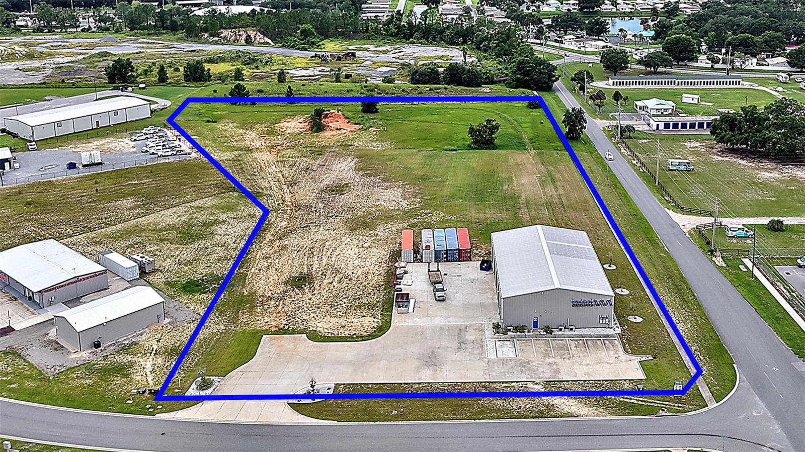 SITE READY 5.76 ACRES, Currently Engineered and APPROVED to Accommodate 4 Office/Warehouse Buildings up to 82,500 square feet. All the infrastructure is in place 36 Water Meters, city sewer and water, and a master off-site storm water management system is already in place. 3-phase power is available, and natural gas is close by. The 6500 Sq Feet WAREHOUSE was built in 2019 and has finished office space and bathrooms. Air-conditioned space of 1,600 square feet, 4 bay doors, doors are 14 feet high 12 feet wide, ceiling height 23 feet. With easy access to I-75 and the Florida Turnpike, located a half mile off Hwy 27/441, with other major roads out of the area. In this location, you're just minutes from the Villages! MASTER CONCEPTUAL PLAN is attached for all the potential this site delivers! INVESTMENT OPPORTUNITY FOR YOUR INDUSTRIAL/ OFFICE-WAREHOUSE LAND IN CENTRAL FLORIDA!