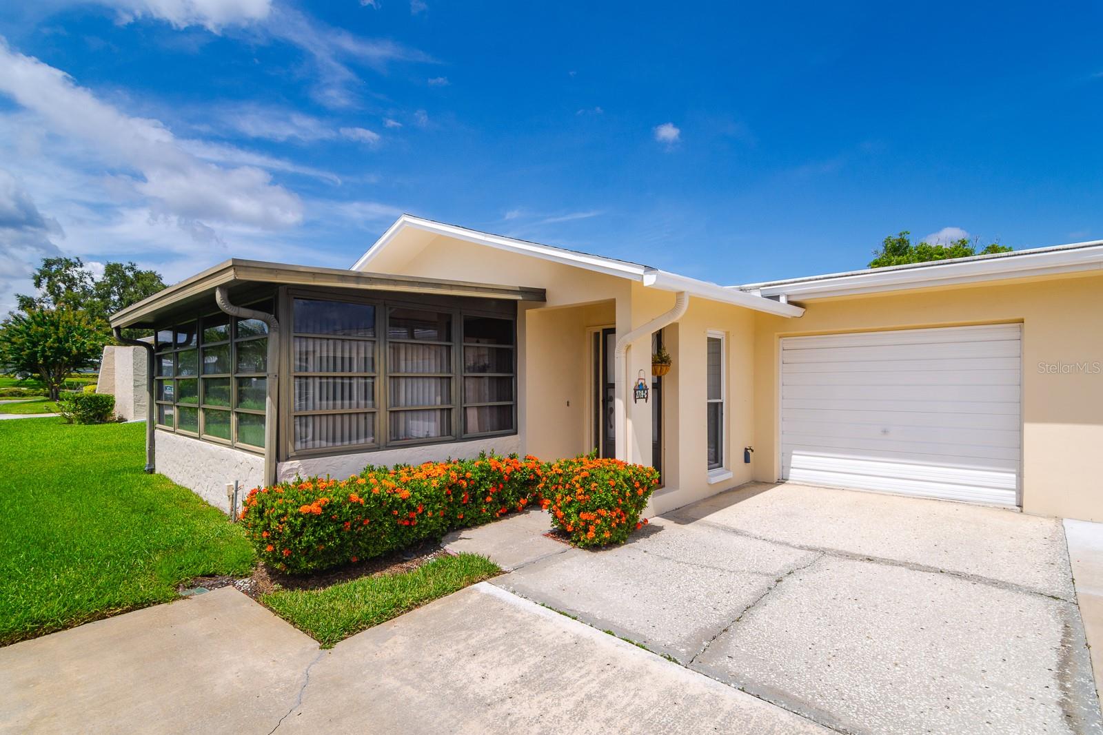 Welcome to this charming and beautifully maintained 1-bedroom, 1-bath villa with a 1-car garage, ideally situated in the highly sought-after 55+ Highland Lakes community. Whether you're looking for a full-time residence or a seasonal retreat, this home offers a perfect blend of comfort, convenience, and vibrant community living.
As you step inside, you'll be greeted by a bright and airy atmosphere, highlighted by large floor-to-ceiling windows and fresh neutral paint throughout. The spacious main living area features brand-new vinyl plank flooring and an open-concept layout that connects seamlessly to the dining space. A large utility and coat closet provides added storage.
Relax with your morning coffee or unwind in the evening in the enclosed sunroom, measuring 15 by 9.5 feet, featuring brand-new indoor/outdoor carpeting, a dedicated A/C unit, and sliding glass doors that let in Florida’s fresh breeze. The kitchen includes updated cabinet doors, a built-in microwave, a dishwasher, and a convenient pantry closet.
The generously sized bedroom offers two walk-in closets, brand-new flooring, a vanity counter with a sink, and private access to a secluded patio through sliding glass doors. The bathroom provides dual access from both the bedroom and hallway and includes a tub/shower combination. In the attached 1-car garage, you'll find the washer, dryer, utility sink, and additional shelving for storage.
This home also boasts a new A/C system installed in 2024 and updated windows and a sliding glass door (2012) with fabric hurricane protection. The villa is condo-owned—no land lease required.
The all-inclusive HOA covers water, sewer, garbage, cable (with two boxes and internet), exterior maintenance such as roof, painting, and concrete/asphalt repair, as well as landscaping, irrigation, pest service, and building insurance.
As part of the Highland Lakes master association, you’ll have access to exceptional amenities including three executive golf courses, a resort-style pool, two clubhouses, tennis, pickleball, bocce, shuffleboard, a woodshop, pottery and arts & crafts studios, an auditorium with shows and concerts, and private lake access with two pontoon boats on Tarpon Lake.
All of this is conveniently located just minutes from top-rated beaches, shopping, dining, medical facilities, and beautiful parks. Don’t miss your chance to make this delightful villa in Highland Lakes your own—schedule your private showing today.