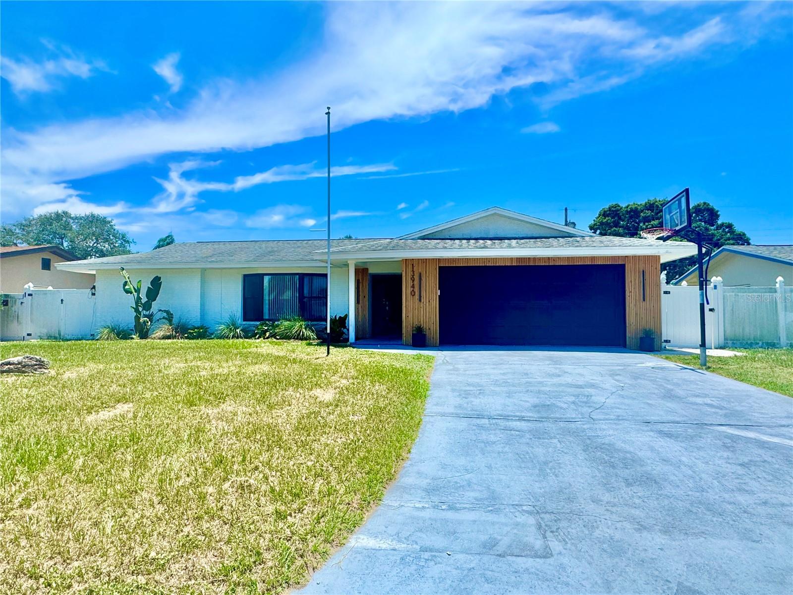 Beautifully updated 3-bedroom, 2-bathroom pool home in a highly desirable Seminole neighborhood. This property features a spacious split floor plan, fully remodeled bathrooms, and a bright, open layout perfect for everyday living and entertaining. The private, fully fenced backyard offers a true resort-style setting with a sparkling pool, expansive wooden deck, and lush landscaping. Partially furnished as shown in the photos. Additional highlights include a 2-car garage, indoor laundry, and ample storage throughout. Located in a top-rated school district, just 7 minutes to the beach and 10 minutes to Seminole City Center. This is Florida living at its best—don’t miss the opportunity to make this your next home.