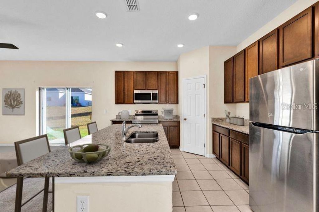 Photo of 3345 Curlew Avenue, Leesburg, FL 34748 (MLS # O6344542)