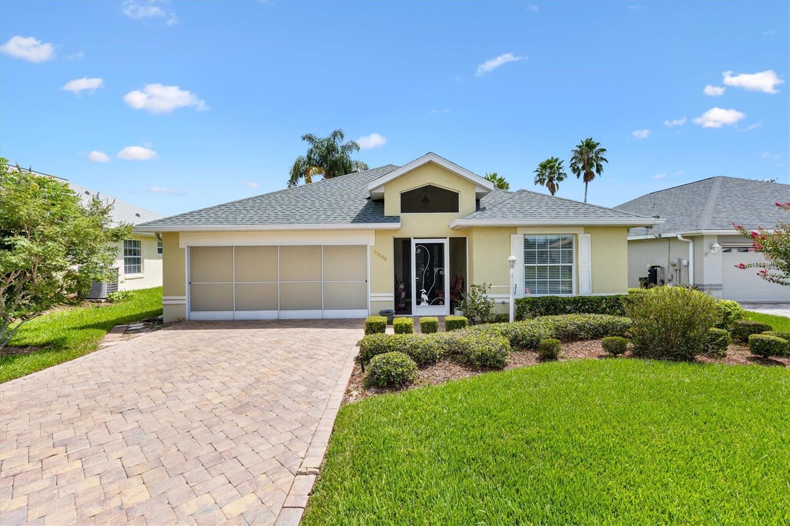 Located in the Exclusive 55+ Gated Golf Community of STONECREST, with all the amenities, adjacent to THE VILLAGES, Florida. 2 Bedrooms plus a versatile DEN/FLEX room, this residence boasts an inviting open floor plan designed for both comfort and style. Recent updates include NEW ROOF (2019), HVAC system (2023), and a new 14 x 12 BIRDCAGE with drain tabs and SLAB (2022). From the moment you arrive, you’ll notice the charming screened front entry, brick paver driveway, and walkway that set the tone for the elegance inside. The eat-in Kitchen is enhanced with a tasteful backsplash, while the spacious primary ensuite Features dual sinks, a dressing table, and a large walk-in shower. The den, framed by French doors, provides a private space for work or relaxation. The enclosed lanai opens to a stunning new birdcage and a patio that’s perfect for outdoor grilling and entertaining. Located in an area of the community where the POA handles all lawn care, weeding, and spraying, you’ll enjoy a carefree lifestyle with more time for what you love. Stonecrest residents have access to world class amenities, a vibrant social calendar with numerous clubs, and the convenience of shopping, dining, and medical facilities all accessible by golf cart. This is retirement living at its finest, blending sophistication, comfort, and the perfect location.