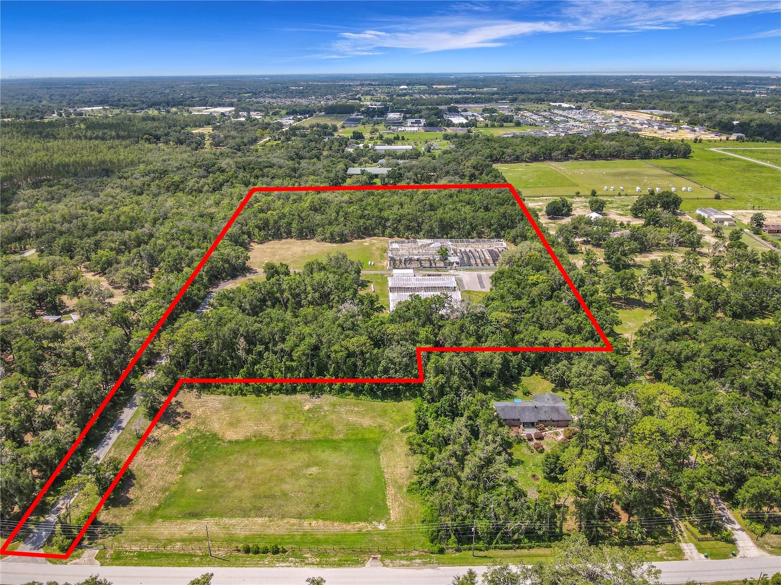 Secluded 15.43 Acre Parcel Near Kelly Park – Prime Development or Estate Opportunity!
Discover a rare opportunity to own 15.43 partially wooded acres along a picturesque Ridge, 125’-140’ of elevation—just 2.4 miles from the SR 429 Kelly Park Rd extension, in one of the fastest-growing corridors of Orange County, no city taxes.
This secluded property offers endless potential: build your private family estate, create an equestrian retreat, or explore development possibilities in a high-demand location. Previously used for agriculture, the land includes steel greenhouses, making it ideal for refurbished agricultural use or repurposing for other ventures.
Tucked away in a serene setting yet conveniently close to the expanding Kelly Park area, this is your chance to invest in land with both privacy and future growth potential.
Call today for your private tour!