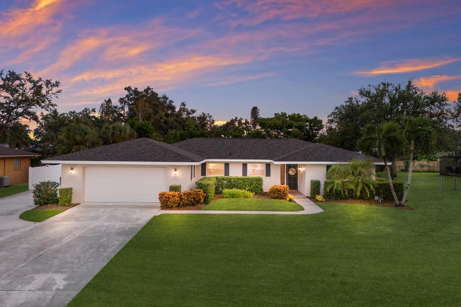 WELCOME TO YOUR OWN PRIVATE OASIS IN NW BRADENTON! This stunning single story 3 bedroom 2 bathroom POOL home with DETACHED MOTHER-IN-LAW SUITE is located on an oversized fenced-in lot! Boasting exceptional curb appeal with its manicured lawn, vibrant landscaping, and inviting walkway that leads to a charming front entry. NEW ROOF, NEW A/C, NEW HOT WATER HEATER, UPDATED POOL AND MORE!!! The freshly paved driveway, complete with a side parking area, adds a touch of elegance while providing ample parking space. From the moment you step inside, you’re welcomed by an inviting foyer that effortlessly flows into a warm and expansive living room—perfect for both entertaining guests or winding down the day. Laminate flooring, custom drapes, and a sleek ceiling fan create a cozy ambiance, while natural light floods the space through large windows and French doors. The heart of the home is the thoughtfully designed kitchen, featuring abundant cabinetry, wraparound counters, and updated lighting. It opens directly to the dining area, which comfortably seats eight—making it ideal for family meals, holiday gatherings, or hosting friends. The bright and airy open floor plan is enhanced by neutral tones, crown molding, and tile flooring, adding a touch of sophistication to every room. The spacious and private primary bedroom is a true retreat, featuring french doors, multiple windows that fill the room with natural light, and a generous walk-in closet. The en-suite bathroom is tastefully designed, complete with a walk-in shower for added comfort and convenience. Located on the opposite side of the home, two additional well-sized bedrooms share a full bathroom. Additional highlights include a large laundry room equipped with a utility sink, built-in cabinetry, and ample storage space. The oversized two-car garage provides plenty of room for vehicles, tools, bikes, and more. Step into the backyard retreat and be amazed by a true entertainer’s dream! The expansive patio surrounds a uniquely shaped, resort-style pool that offers the perfect setting for relaxation or gatherings. A large detached garage or workshop at the rear of the property adds incredible functionality—ideal for hobbyists, additional storage, or even a home gym.! Adjacent to the garage, the detached mother-in-law suite was originally designed as a one-bedroom, one-bathroom unit. The current owner has temporarily capped the plumbing and is using the space as air-conditioned storage. With over 400 square feet available, it can easily be converted back or reimagined to suit your needs. One of the premier streets in NW Bradenton, with oversized lots that sit high above the street and NO HOA OR FLOOD ZONE!!! FULLY FENCED AND LOTS OF ROOM TO STORE BOATS, RVS, AND MORE! Located only minutes to the white sandy beaches of Anna Maria Island and a short distance to downtown St. Pete and the cultural & culinary arts of Sarasota. Walk or ride bikes to the Robinson Preserve, a 682-acre nature preserve offering trails, kayak launches, scenic lookouts and picnic areas. Come see this spectacular NW Bradenton beauty for yourself before its gone!