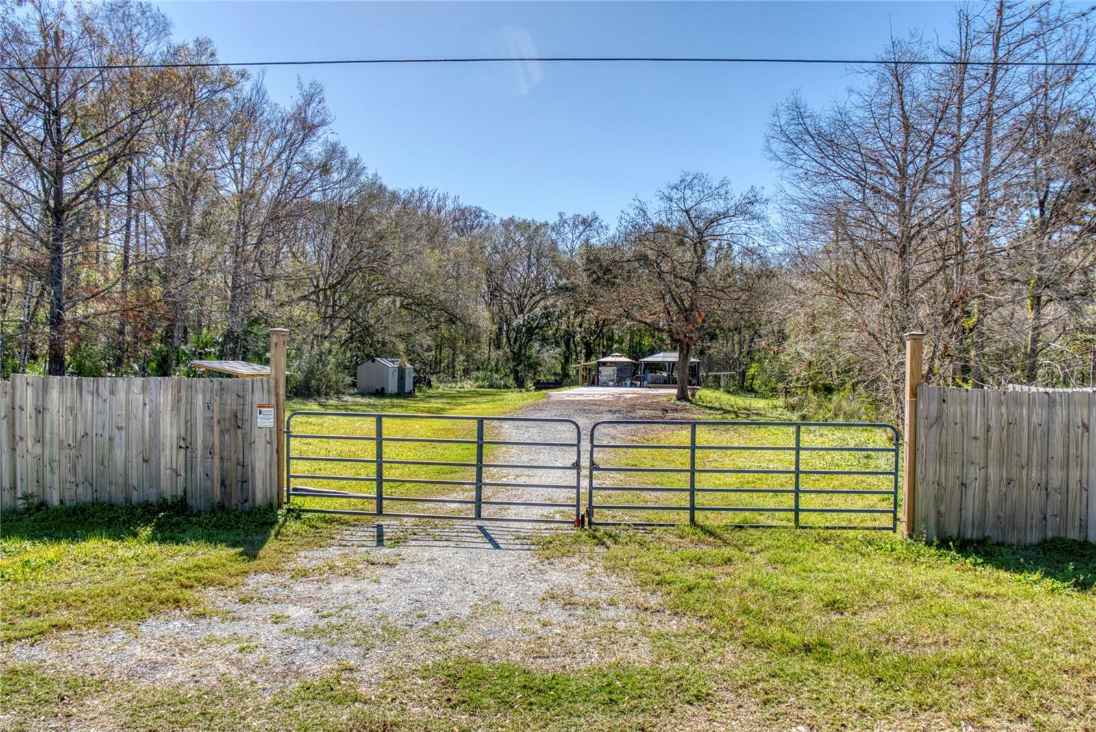 Secluded & Serene—Your Perfect Escape Awaits!
Discover the opportunity to own a private, gated slice of paradise! This beautiful vacant lot offers a spacious, cleared area with a gravel driveway leading to a concrete pad, ideal for your future home, a weekend getaway, or an investment property. Surrounded by lush trees and nature, this property provides the perfect blend of tranquility and convenience. Ample space for gardening, recreational activities, or expansion. Whether you’re looking to build, invest, or escape the hustle and bustle, this property is a rare gem waiting for the right owner!
Call today to explore the possibilities and make this land yours!