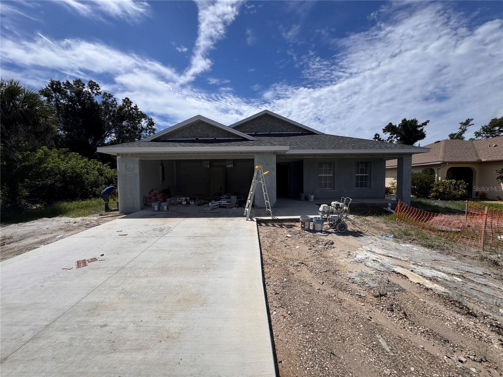 Under Construction. NO FLOOD ZONE....Our Model features an open floor plan from the minute you walk in the door. This home as 1752 sq foot of Living Space, 3 bedrooms, 2 baths and 2 Car Garage with a large Lanai. The open kitchen is perfect for entertaining, includes a spacious island, breakfast/dining area, and French Doors leading to the lanai to enjoy your morning coffee. The master bedroom includes a walk-in closet, Tiled shower, and Dual sink vanity. The 2 Guest bedrooms are located on opposite side of Master making it a split floor plan. Guest bathroom has a tiled shower/tub combo. The living room features cathedral ceilings. The home features plank tile throughout, granite countertops in the kitchen and bathrooms, recessed lighting, ceiling fans in every room, and Stainless Steel Appliances. The home comes with hurricane/storm shutters. COME VIEW THIS BEAUTIFUL HOME or CALL TODAY FOR AN UPDATED LIST OF OUR BUILDS! PLEASE NOTE - the pictures for this listing are a representation of the subject home being constructed. Interior and exterior paint colors, tile color, shingle colors, tray ceilings, fans, lights, manufacturer of appliances, interior/exterior door style, cabinets and landscaping are subject to change. Tax Information is for vacant land