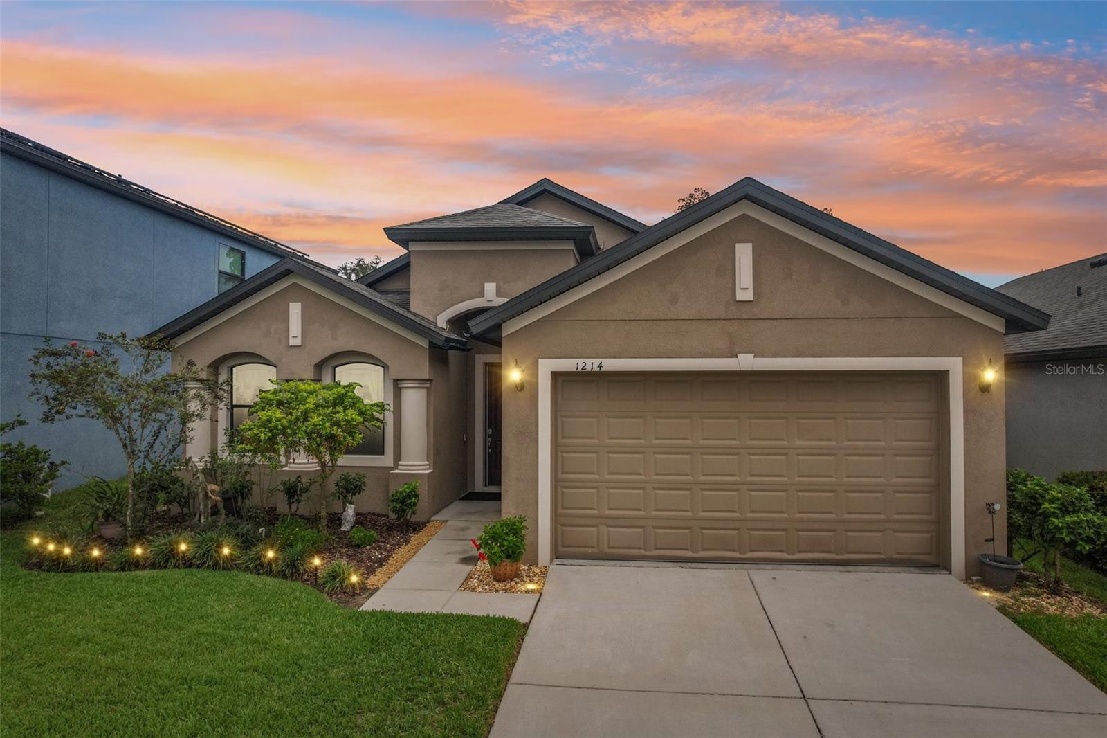 One or more photo(s) has been virtually staged. Step into a home where every detail has been thoughtfully curated for a lifestyle of comfort, convenience, and effortless Florida living. Nestled within a BOUTIQUE, QUIET & PRIVATE GATED COMMUNITY—with the rare financial advantage of a LOW HOA and NO CDD fees—this 3-bedroom, 2-bathroom WILLIAM RYAN "SANIBEL" MODEL is a testament to intelligent design.
From the moment you enter, the soaring 9-FOOT CEILINGS AND UPGRADED 8-FOOT DOORS create a sense of volume and light, guiding you across easy-to-maintain tile floors into the heart of the home. Here, the OPEN-CONCEPT LIVING SPACE is perfect for family life or entertaining. Imagine friends and family gathered around the spectacular 6' X 8' GRANITE ISLAND as you prepare meals in an UPGRADED KITCHEN EQUIPPED WITH 42-INCH SOLID WOOD, SOFT-CLOSE CABINETS AND A SUITE OF SLEEK, FINGERPRINT-RESISTANT SLATE APPLIANCES, INCLUDING A VERSATILE GAS DOUBLE OVEN WITH A GRIDDLE. There is also a KITCHEN DESK/BAR WITH ADDITIONAL CABINETS ABOVE and a LARGE, WALK-IN PANTRY.
Blur the lines between indoors and out by retracting the WALL OF TRIPLE SLIDERS to reveal your personal oasis: AN IMMENSE 8’ X 40’ SCREENED LANAI. This is where your days will begin with a quiet coffee and end with relaxing evenings, all while enjoying the perfect Florida breeze.
When it's time to unwind, your private primary suite awaits. Offering its own separate triple-slider access to the lanai, this serene retreat features a spa-like ensuite bathroom with a stunning, OVERSIZED WALK-IN GLASS SHOWER, DUAL SINKS, AND A GENEROUSLY SIZED WALK-IN CLOSET. The bathroom also has a WATER CLOSET for privacy.
This home is truly engineered for the modern world. The 4-FOOT EXTENDED GARAGE, WITH ITS 10-FOOT CEILINGS AND 8-FOOT HURRICANE-RATED WIFI DOOR, is a purpose-built space for full-sized trucks or SUVs and comes future-proofed with a 50 AMP OUTLET for your EV charger or power tools. INTEGRATED SMART HOME FEATURES—INCLUDING THE THERMOSTAT, LIGHTS, DOORBELL, AND SECURITY WIRING—put control at your fingertips.
From abundant storage solutions to the peace of mind offered by an IN-WALL PEST CONTROL SYSTEM AND RAINBIRD SPRINKLERS, every element of this home works in harmony. All of this, plus this home is ideally positioned for an effortless lifestyle, offering swift access to major commuter routes including I-75 and I-4, and placing you less than 20 minutes from the vibrant heart of downtown Tampa. Enjoy world-class dining, sporting events, and cultural attractions, all just a short drive away. This isn't just a property; it's the backdrop for your new life.