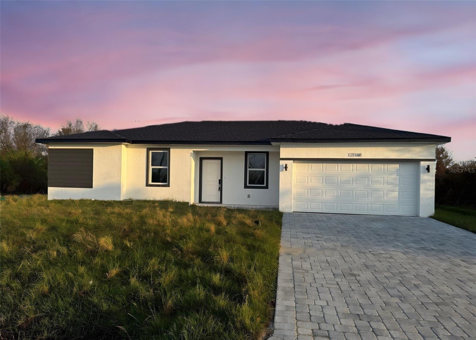 Experience modern Florida living in this brand-new construction 4-bedroom, 2-bath home in Port Charlotte with no HOA, no CDD, and no rental restrictions. Designed for style and efficiency, this open-concept layout features a spacious great room, dining area, and a stunning kitchen with 42" upper cabinets, quartz countertops, an island and stainless steel appliances.
Enjoy luxury waterproof vinyl plank flooring throughout, In the master bedroom a fully tiled walk-in shower, a private owner’s suite with dual sinks and large walk-in closet. The split floor plan offers privacy for guests or family, with additional three bedrooms and the second full bathroom, which also includes fully tiled shower and tub surrounds.
Built with energy-smart features including Low-E windows, high-efficiency mechanicals, and low-flow fixtures, this home helps keep utility costs low. Additional highlights include a paver driveway, 2-car garage, and interior laundry room.
Located just minutes from beaches, shopping, dining, and I-75, this home offers the perfect mix of comfort, freedom, and value—without the builder markup. Move-in ready and packed with upgrades—don’t miss it!