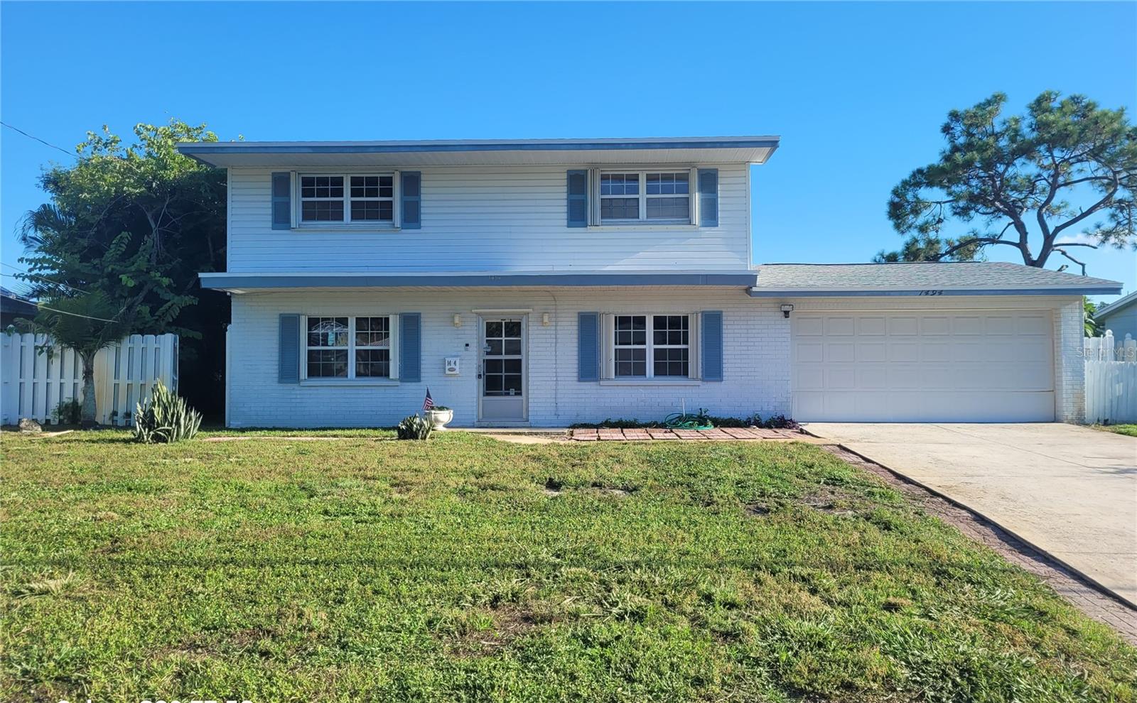 Living and Loving the Florda Lifestyle! This beautiful 3-bedroom, 2.5-bathroom lakefront home offers everything you’ve been looking for! Featuring a spacious 2-car garage, new roof in 2025, freshly painted interior, newer hurricane windows and garage door, newer AC unit and hot water heater, updated kitchen with stainless steel appliances, beautiful tile floors downstairs and original hardwood floors upstairs. The kitchen features a passthrough that opens into the cozy family room, making it ideal for entertaining. The living/dining room opens to a nice size Florida room that goes out to the pool area. The second floor includes 3 large bedrooms with plenty of natural light and beautiful hardwood floors. The master bedroom has a large walk in closet. Enjoy the Florida summers with a sparking pool to cool off in or sit by the edge by the lake and fish or watch the beautiful sunsets. Additional features include a newer pump for the irrigation system and a brand new pump for the pool. The stove and hot water heater run on gas to save on the electric bill. The neighborhood is upscale and friendly, great for individuals and families alike. Located near public transportation, shopping, restaurants and I275, within 15 minutes of Tama Airport, within minutes in any directions to award winning beaches. Make your appointment today to see this beautiful home.