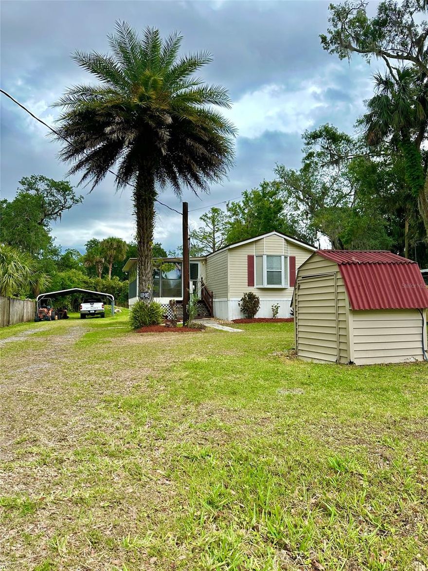 Where else are you going to find a well-maintaned home and property (you own it!) in the heart of NSB, just minutes to the river and beaches at such an affordable price? Perfect for snowbirds, rental investment or full-time living. Have kids? This home is a short bike ride to NSB high school and middle school. This immaculate 1995 2BR/2BA manufactured home sits on over a quarter acre of land with a 2-car carport and storage shed.  You'll appreciated the well-maintaned landscaping and inviting steps to your front door. Enter the home via the spacious 12 X 17 florida room that is perfect for all seasons. Upon entering the home, you'll be aw at the open floorplan with vaulted ceilings throughout. New wood laminate flooring creates a wonderful ambiance that is as easy on wear and tear as it is on the eyes. The eat-in kitchen is open to the large family room. The kitchen has ample counter space and lots of cabinets for storage.  There's even a separate laundry room with side exit door. The master suite is sure to wow with its extra arge space and loads of closet storage. The guest bedroom is equally large with room for 2 twin beds! There's a hall bath for 2nd bedroom and guests. Recent upgrades to the property include new AC, new 2023 architectural shingle roof (with peel & stick underlayment), newer pump, and over 50% of the wood fencing replaced! Property is a must see to fully appreciate all it has to offer.  This will sell fast so make plans to stop by for a private showing before it's gone! ALL INFORMATION IS ASSUMED ACCURATE BUT NOT GUARANTEED. ALL MEASUREMENTS ARE APPROXIMATE. BUYERS AND THEIR AGENTS SHALL VERIFY ANY INFORMATION DEEMED IMPORTANT TO THEM