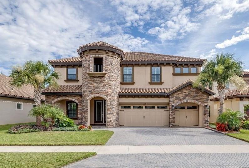 Welcome to your dream home in the luxury gated Pristine Lake Preserve Community Featuring Homes by WestBay. This Verona floor plan offers the perfect blend of luxury, functionality, and style. With 5 spacious bedrooms, 4 full bathrooms, a dedicated office, and an oversized loft, there’s room for everyone to live, work, and play in comfort. As you pull up to the impressive European Country style exterior, which is the only one in this beautiful community, you will be immediately captivated by the stunning features including a tile roof, pavered driveway, enhanced stonework and an expansive 3 car garage. Upon entering, you are greeted with beautiful natural light which accentuates the large open floor plan and abundance of upgrades. Crown molding wraps both the downstairs and upstairs floor plan. Double french doors lead you into your dedicated office or flex space making it the perfect extra space for play or work. Continuing down the large foyer you enter into the oversized gourmet kitchen and open concept living room with a custom accent stone wall. Your kitchen is overflowing with upgrades, including a professional gas stove, built in stainless steel appliances, enhanced cabinetry and a beautiful glass mosaic backsplash, not to mention an abundance of cabinet & storage space. Oversized sliding glass doors open up the downstairs area making this the IDEAL home for seamless indoor/outdoor living. Enjoy the serene views of your expansive fenced in CONSERVATION lot and oversized lanai area, which is large enough for any custom backyard plans you can dream of! Completing your downstairs area is a bedroom and full bath with a door leading out to the extended covered lanai, making this the perfect guest suite or pool bath! As you make your way upstairs, you'll find four additional bedrooms, each equipped with walk-in closets, offering ample storage for everyone. The oversized bonus room serves as a versatile retreat, perfect for movie nights, a game room, or additional living space. The thoughtfully located second-floor laundry room will simplify your daily chores, while a Jack-and-Jill bathroom connects two of the bedrooms for added convenience. This home truly has everything you could imagine, including plantation shutters throughout, a whole home water softener, tankless water heater, and water purification system. Outside of the home residents enjoy access to the community lake, ideal for boating and fishing, a gated entrance, and a well manicured park and playground. Call to schedule your private showing now.