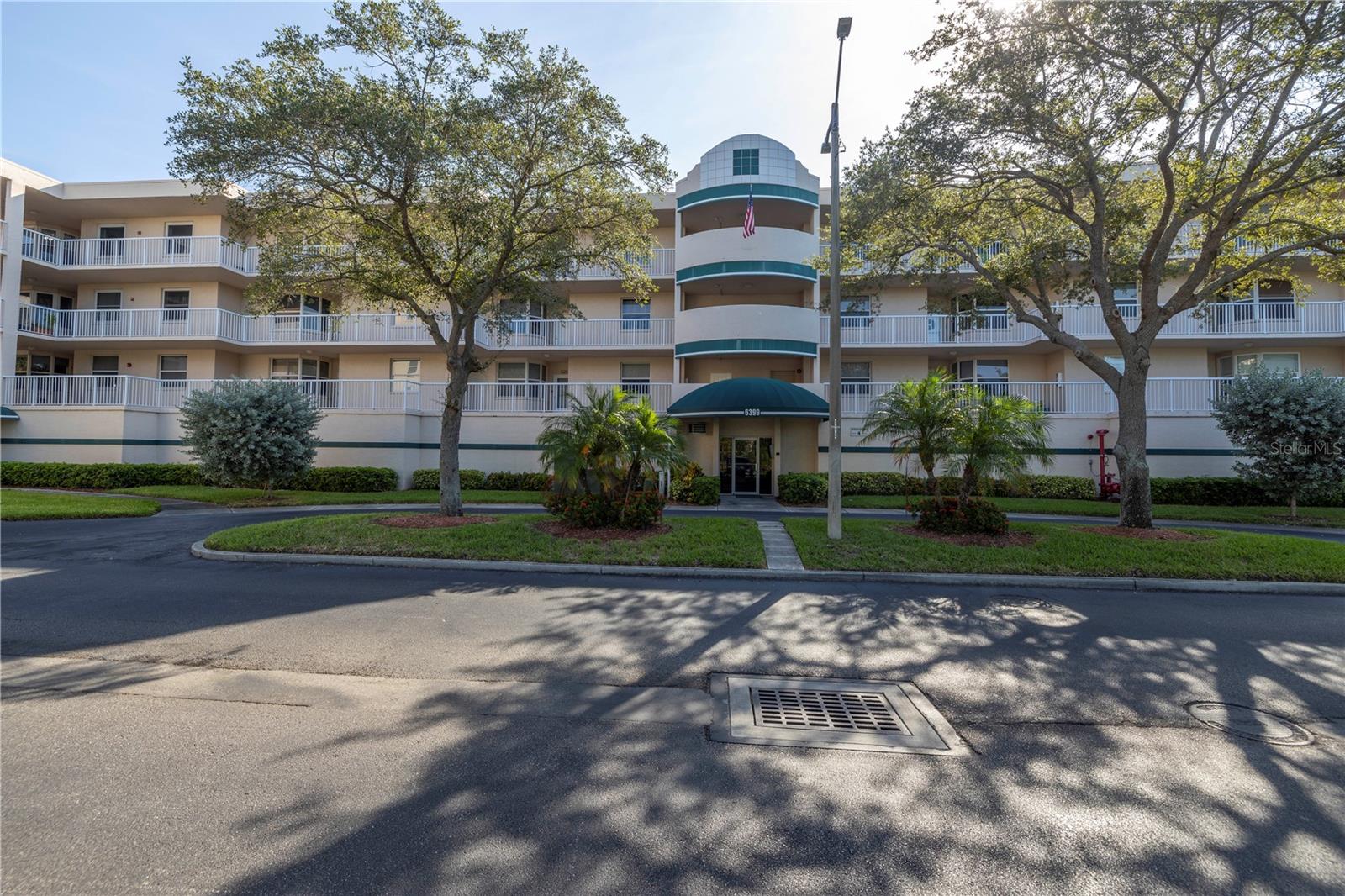 YOUR FLORIDA DREAM COMES TRUE – COMPLETELY REMODELED WATERFRONT CONDO – WATERVIEWS FROM EVERY WINDOW! This 3 bedroom, 2 bath, PRIVATE 1 ½ CAR GARAGE rarely available in the highly desired community of Shores of Long Bayou. The kitchen is a chef’s dream, completely updated with granite countertops, hardwood soft-close cabinets, a custom, deep pantry with pull out shelves, stainless appliances, tray ceilings with recessed can lights, and breakfast bar. Chef’s kitchen has room for an eat-in breakfast nook that overlooks the water and there is also a separate dining room. LIGHT AND BRIGHT – this open floorplan has plenty of space to entertain with the large living room and sunroom, both featuring sweeping views of the waterfront bayou. The split bedroom floorplan allows for privacy in all areas of this home. Primary bedroom features an en-suite bath, complete with his and her walk-in closets, dual vanities, quartz counters, hardwood cabinets, top of the line walk-in tiled shower with teak fold away bench and upgraded recessed light fixtures. Extra-large primary bedroom will accommodate a large King-sized furniture set. Second bath is complete with a tub shower combo. Pride of ownership is clear here in both this unit and the community. No detail has been missed – Updated Impact rated windows, New Roof (2024), Newer AC (2018), New Water Heater (2019), new flooring and crown moulding throughout, refrigerator with double ice maker, and whole house water filter system. Private utility room inside your unit makes doing laundry a breeze. Oversized 1 ½ car garage boasts high ceilings able to accommodate extra storage , complete with a pedestrian door and hurricane rated garage door. Plenty of space for a car AND a golf cart. Air-conditioned storage room and garage provide plenty of room for your car or toys, this home has it all. Water views of the expansive bayou from most rooms. This End Unit means that you have a large front patio overlooking the lake, as well as the sunroom overlooking the bayou – WATERVIEWS ON BOTH SIDES! Quiet neighborhood has a 24 hour gated access with guard, secure door to the building lobby entrance and enclosed elevator entry. All of this luxury and security in a park-like setting. Community features includes a 77 acre nature preserve with heated pool, spa, grill, clubhouse with fitness center. Low monthly condo fees include cable, internet, sewer, water, trash and in-unit bi-monthly pest control – SAVES YOU MONEY $$!! Close to restaurants, shopping and award winning beaches.