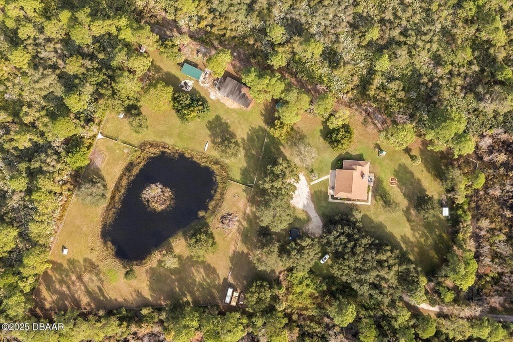 Photo of 475 Lazy Z Lane, Oak Hill, FL 32759 (MLS # FC315134)