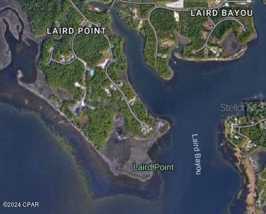 VACANT RESIDENTIAL LOT IN A GATED WATERFRONT COMMUNITY.