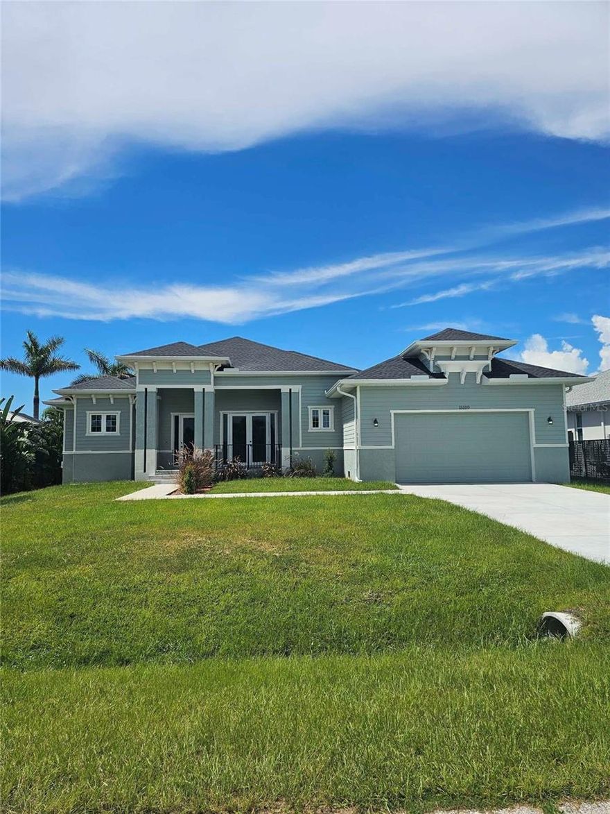 Brand-new waterfront 4-bedroom, 3.5-bath home in South Gulf Cove with boat access. This custom-built residence features an open floor plan, high ceilings, and designer finishes throughout. The kitchen includes quartz countertops, stainless steel appliances, and a large island ideal for entertaining. The primary suite offers dual vanities, a walk-in shower, and generous closet space. Additional bedrooms provide comfort and flexibility for family or guests. The backyard overlooks a canal with a concrete seawall and direct access to Charlotte Harbor and the Gulf. Located in the desirable South Gulf Cove community, close to beaches, golf, dining, and shopping.