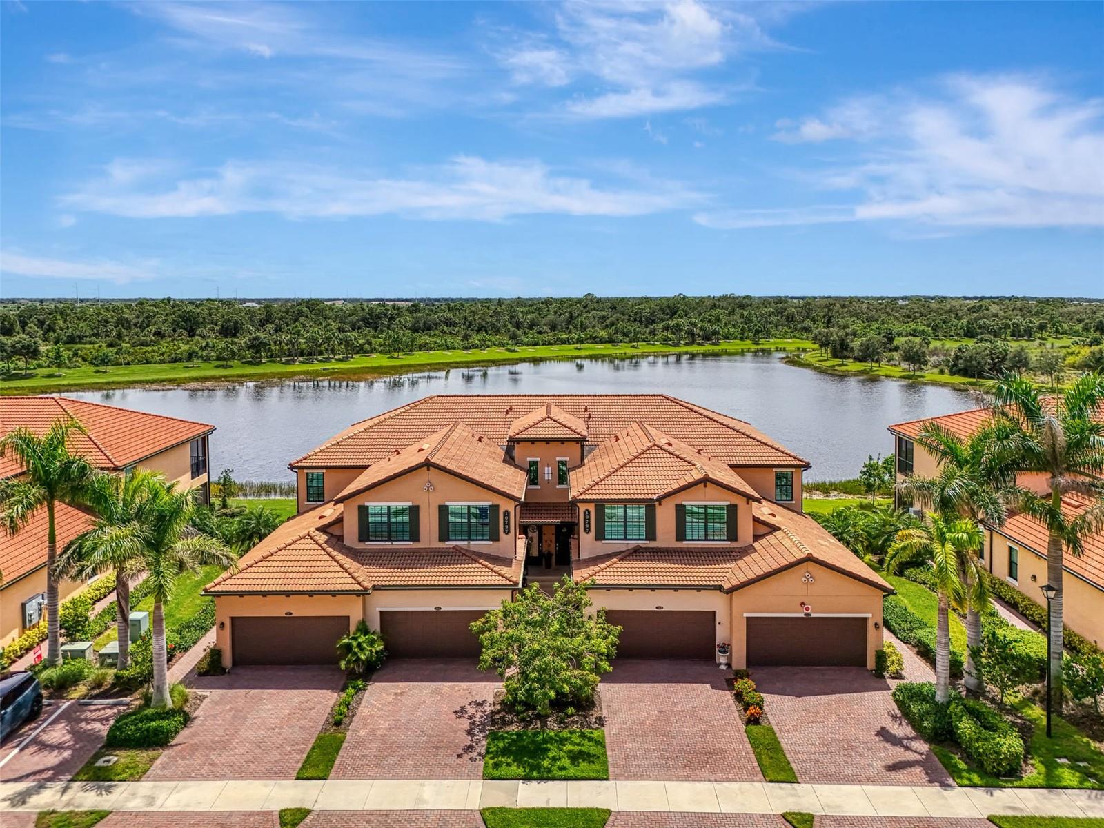 Now is your chance to own this lavishly upgraded TOP FLOOR END UNIT condo, located in the highly sought after guard gated golf community of Sarasota National. Enjoy SOUTH FACING water and preserve views right from the comfort of your oversized screened lanai. HURRICANE IMPACT GLASS throughout! Step through the front door to find an impressive 2-story foyer entrance that was re-imagined with custom installed stair treads with matching banister and a decorative tile landing. Once upstairs you will appreciate a large open floor plan that was made for entertaining. Impress your guests with the thoughtfully designed wine bar with hand crafted wood top and sleek floating shelves. The kitchen showcases an designer backsplash, an oversized island outfitted with decorative woodwork, and tasteful quartz countertops. There is a large pantry with custom shelving system, and the cook of the family will enjoy a sleek stainless steel appliance package. The large living room is a great space to gather with friends or to relax and unwind after an enjoyable day on the golf course. Enjoy spectacular water views from every angle as you move through the home. Other upgrades include tile on the diagonal in the main living areas, crown moldings, plantation shutters, and designer light fixtures and fans. The primary suite offers ample space with extra room to create a home office or sitting area. A set of sliders lead out to the lanai, and a large window allows you to enjoy the stunning view right from the comfort of your bed. 2 walk-in closets with custom closet systems provide impressive organization. The en suite bathroom showcases dual vanities with extra storage, an oversized walk-in shower with seamless glass enclosure, and a private water closet. On the opposite side of the condo, you will find 2 additional bedrooms equal in size, both offering generous walk-in closets. A second full bathroom is just off the two extra bedrooms and features a tub/shower combo. It is easy to create privacy for guests from the main living space by closing the hallway privacy door. There is an in-unit laundry room with an upgraded stackable washer and dryer, freeing up space for more storage. Also included is a large 2 car garage with a 3rd tandem space to create a workshop, home gym, or to store your toys. This building is completely maintenance free and includes all landscaping maintenance, pest control, cable tv, water, sewer, and trash pick-up. Your monthly HOA fee also includes 2 GOLF MEMBERSHIPS that require no extra buy-in fee! This condo is perfect to use as a full-time residence, a part-time seasonal home, or even a great investment... one that will generate substantial rental income! Live like you are on a 5-star vacation with a 30,000sf clubhouse with resort style pool, hot tub, outdoor tiki bar serving food and drinks daily, a coffee house, fine dining restaurant, 7,000sf fitness center with top-of-the-line equipment and classes, day spa, card room, bocce ball, pickle ball, tennis, dog park, playground, event lawn, and 18-hole championship golf course. Sarasota National is a guard gated 2400-acre International Audubon Bird Sanctuary that offers some of the most beautiful water and preserve views in all of Venice. This home is just minutes to the Atlanta Brave's spring training camp at the CoolToday Park Stadium, as well as the town center of Wellen Park. Explore 3 local beaches and historic downtown Venice, all less than 15 minutes from your front door!