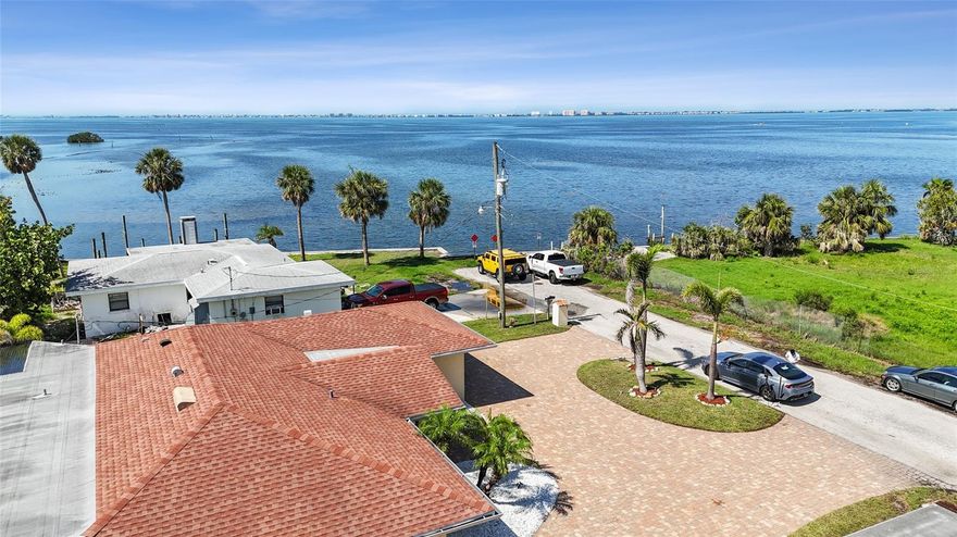 A TRULY WATER LOVER'S PARADISE SIGNIFICALLY REDUCED TO SELL!!! What a location! what a view! a unique spot of the Bay to watch your Sunsets! Easy access to the Bay from this canal-front home just one house in!. This is a complete newly remodeled 3/3 with a 2 car garage Bay front home!. Great 2 "in suite" bedrooms + a single full bathroom. Everything in this house is been completely remodeled from floors to ceiling. The house features a New 3.5 Ton A/C unit, 1.5 Ton A/C unit in enclosed Lanai, New 24x24 Porcelain tile floors, New modern square baseboards, 8.2'' Ceiling, New Gen Samsung SS Appliances, New Samsung Washer & Dryer, New lightning, New garage door motor, New garage epoxy floor, New exterior double impact windows, New main door, New bathrooms, New kitchen with 42" cabinets, 8 years old Roof, 8 years old Sea Wall, reinforced structure beams, double insulation and double 3/4'' panels in enclosed lanai roof, this was built for a future Sun Deck. Lots of details to be described herein. NO HOA, NO CCD Tax ! Don't lose the opportunity to schedule a showing and learn more about it for yourself!