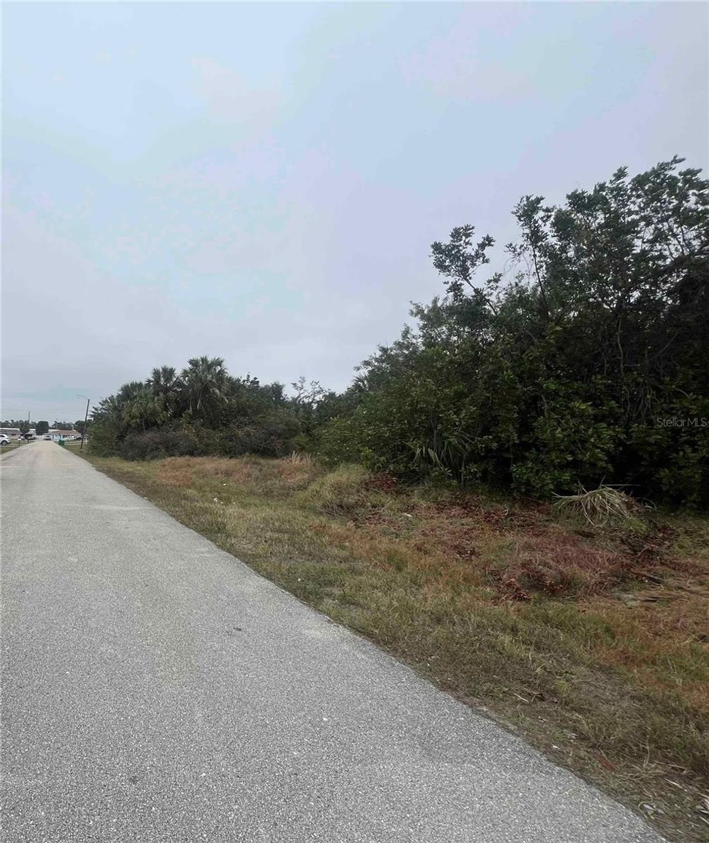 Photo of 657 Cape Terrace NW, Port Charlotte, FL 33952 (MLS # OM693499)