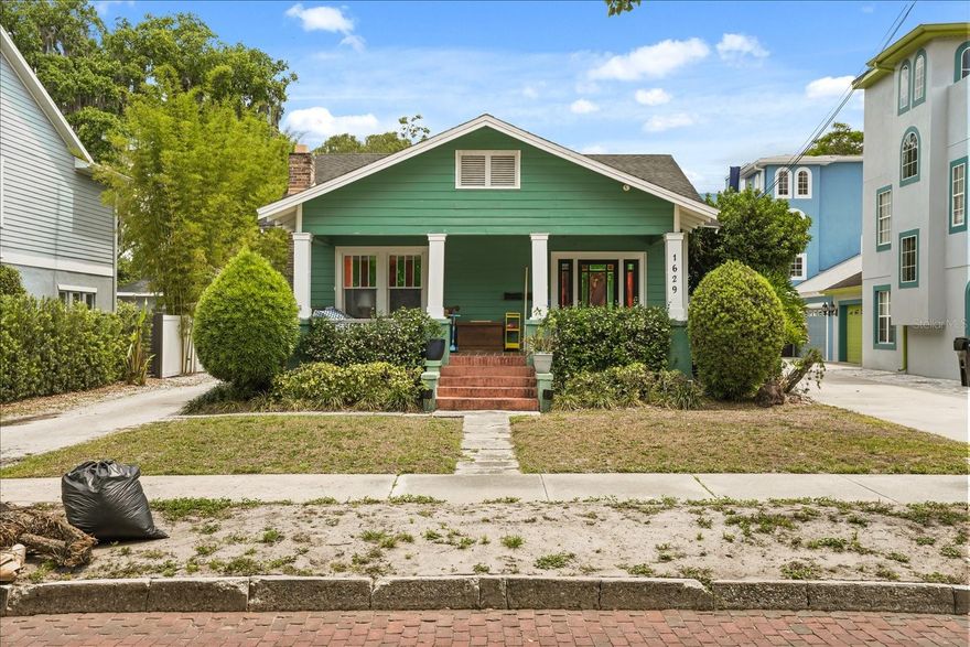 Located on a brick-lined street in Orlando’s sought-after Lake Formosa area, 1629 and 1631 Ferris Avenue present a unique opportunity to own an income-producing property with flexibility for a variety of living and investment needs.

The primary residence at 1629 Ferris Avenue is a historic bungalow featuring original wood flooring, a fireplace, built-ins,spacious living and dining areas, and updated kitchen with stainless steel appliances including a gas range, granite counters, and an island. Bathrooms are nicely updated and primary bath features marble floors, double vanities, walk-in shower, and a claw foot tub and blend classic charm with modern functionality. A large covered front porch adds inviting outdoor living space, while bonus rooms provide options for a home office, studio, or additional flex space.

The detached residence at 1631 Ferris Avenue offers additional versatility as a guest house, rental opportunity, or private workspace creating multiple possibilities for owner occupants and investors alike.

Positioned near downtown Orlando, Loch Haven Park, the Orlando Science Center, AdventHealth, dining, shopping, and cultural destinations, this property offers convenient access to major roadways, parks, and everyday amenities.

Whether you’re seeking a primary residence with supplemental rental potential or a multi-unit investment opportunity, this rare Ferris Avenue offering combines historic character, functional flexibility, and an exceptional central Orlando location.

Roof replaced on both houses in 2017. AC in front house is 6 years old, AC in rear house is 3 years old, plumbing and electrical are updated