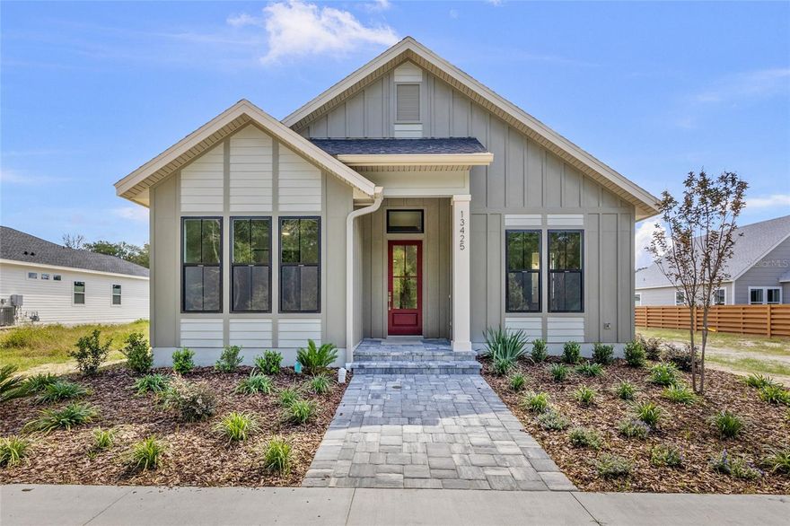 New Construction Home - Move in Ready!
Introducing your future dream home — a cozy and inviting 4-bedroom, 3-bath Tommy Waters Custom Home, artfully designed with clean, modern lines and timeless charm. Thoughtfully crafted, this home offers everything you need and nothing you don’t, with lots of upgrades and attention to detail throughout.
Features include crown moulding, an electric fireplace, custom cabinetry, quartz countertops, upgraded appliances, and so much more — truly a must-see!
Enjoy high ceilings, a spacious open floor plan, and an abundance of natural light that creates a bright, welcoming atmosphere. The layout flows seamlessly into a private courtyard style screened side porch, perfect for relaxing or entertaining year-round.

Located in the golf cart-friendly community of Town of Tioga, residents enjoy access to amenities including a pickleball court, clubhouse, community pool, playground, tennis courts, sand volleyball, basketball courts, and walking trails. Plus, you're just steps from Tioga Town Center, offering fine dining, boutique shopping, and Gainesville Health and Fitness right next door. Approximately 4 miles to I-75, 4.5 miles to North Florida Regional, 8 miles to the University of Florida, and 11 miles to Shands.