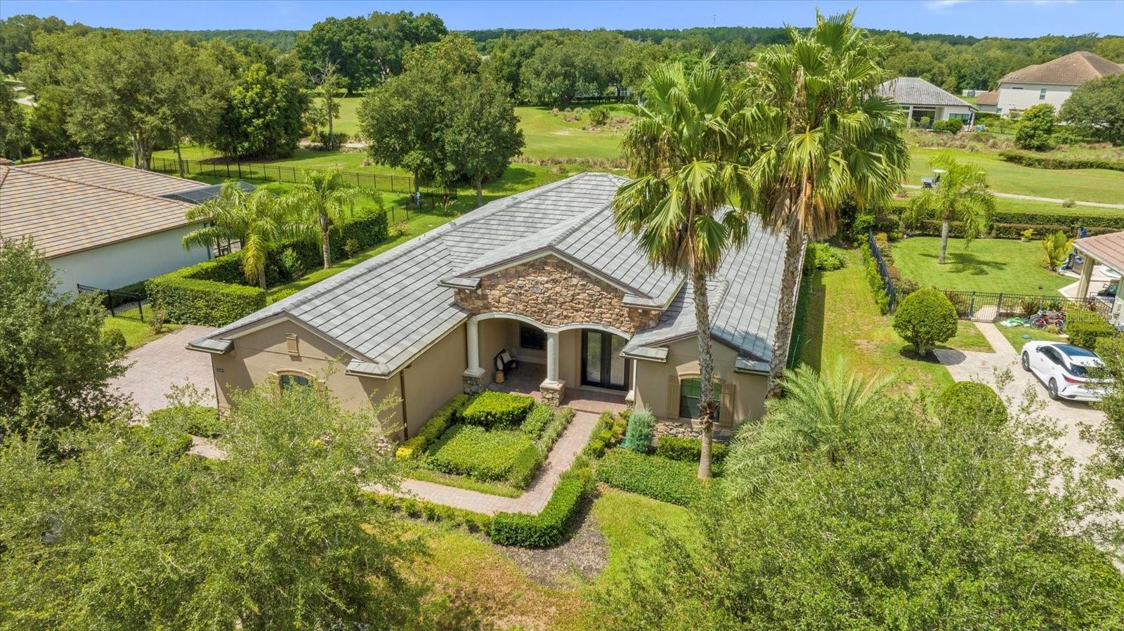 One or more photo(s) has been virtually staged. Enjoy breathtaking sunsets from this beautiful 4-bedroom, 3-bath, 3-car garage home on nearly half an acre in the renowned, gated RedTail community. The sellers are motivated and ready to sell! This light-filled home features soaring ceilings, open-concept living, and a completely renovated kitchen with brand-new LG stainless steel appliances, quartz countertops, oak cabinets, and a spacious island with bar seating. Formal and informal living areas open to a large screened lanai with serene golf course views—perfect for entertaining. The primary suite offers a private sitting area, soaking tub, walk-in shower, and double vanity, while the remodeled secondary suite provides backyard access and its own ensuite bath. A versatile fourth bedroom can also serve as an office. **Zillow’s new wand icon lets you view AI re-imagined styles of the photos, making it easier to picture yourself in the space.** RedTail residents enjoy world-class amenities including an 18-hole golf course, fitness center, pool, tennis courts, and clubhouse dining. Conveniently located near historic downtown Mount Dora and just minutes from the 429, you’ll have quick access to Orlando, the airport, and beaches. Schedule your private showing today and take advantage of this rare opportunity!