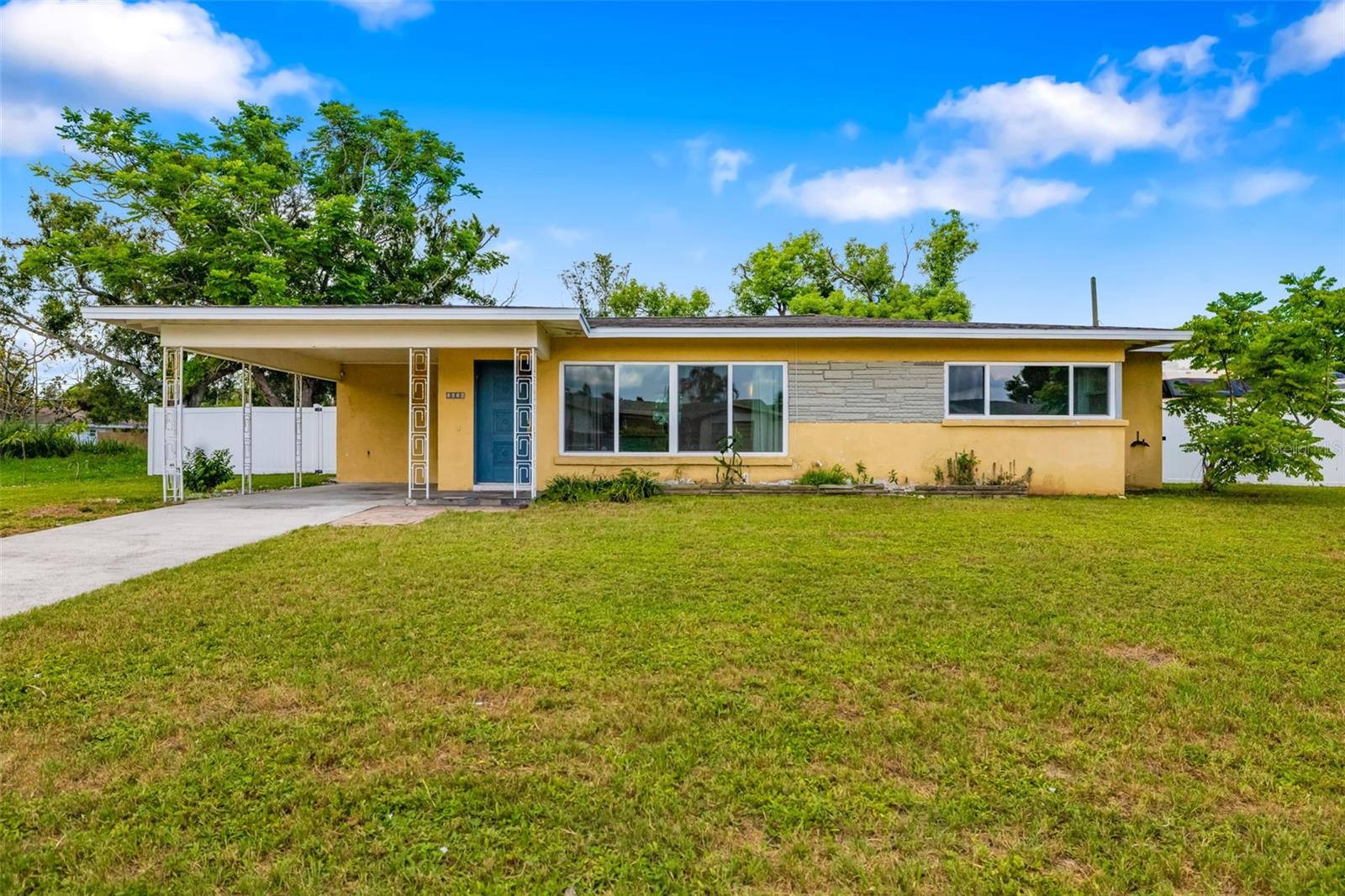 One or more photo(s) has been virtually staged. Enjoy all that Sarasota has to offer in this classic 1950s block home, ideally located in the centrally located Southgate neighborhood. Featuring two bedrooms, two bathrooms and a large .25 acre lot, this home offers a light-filled open floor plan with original terrazzo floors throughout. The MAJOR UPDATES have been completed—including a NEW ROOF (2024), NEW WINDOWS (2024), NEW PLUMBING/SEWER LINES (2021), and a newer HVAC system (2017)—so bring your vision to make this home your own. The bright, airy kitchen was remodeled in 2017 with stainless steel appliances, white cabinetry, white rock salt countertops, and a large island with cooktop making it perfect for everyday living and entertaining. Brand new impact sliders connect the kitchen and dining to a screened porch with peaceful views of the creek. Situated close to Sarasota Memorial Hospital, downtown Sarasota, upscale Southside Village, St. Armands Circle, world-renowned Siesta Key and Lido Beaches, and A rated schools like Southside Elementary, this home is perfectly positioned for enjoying the very best of Sarasota. This is a great opportunity in an unbeatable location!